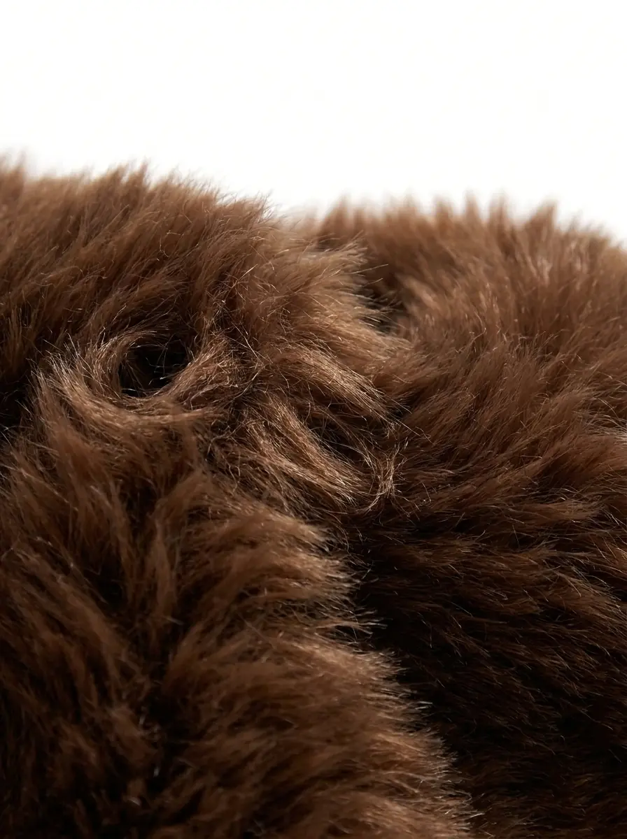 Close-up of soft brown faux fur jacket texture