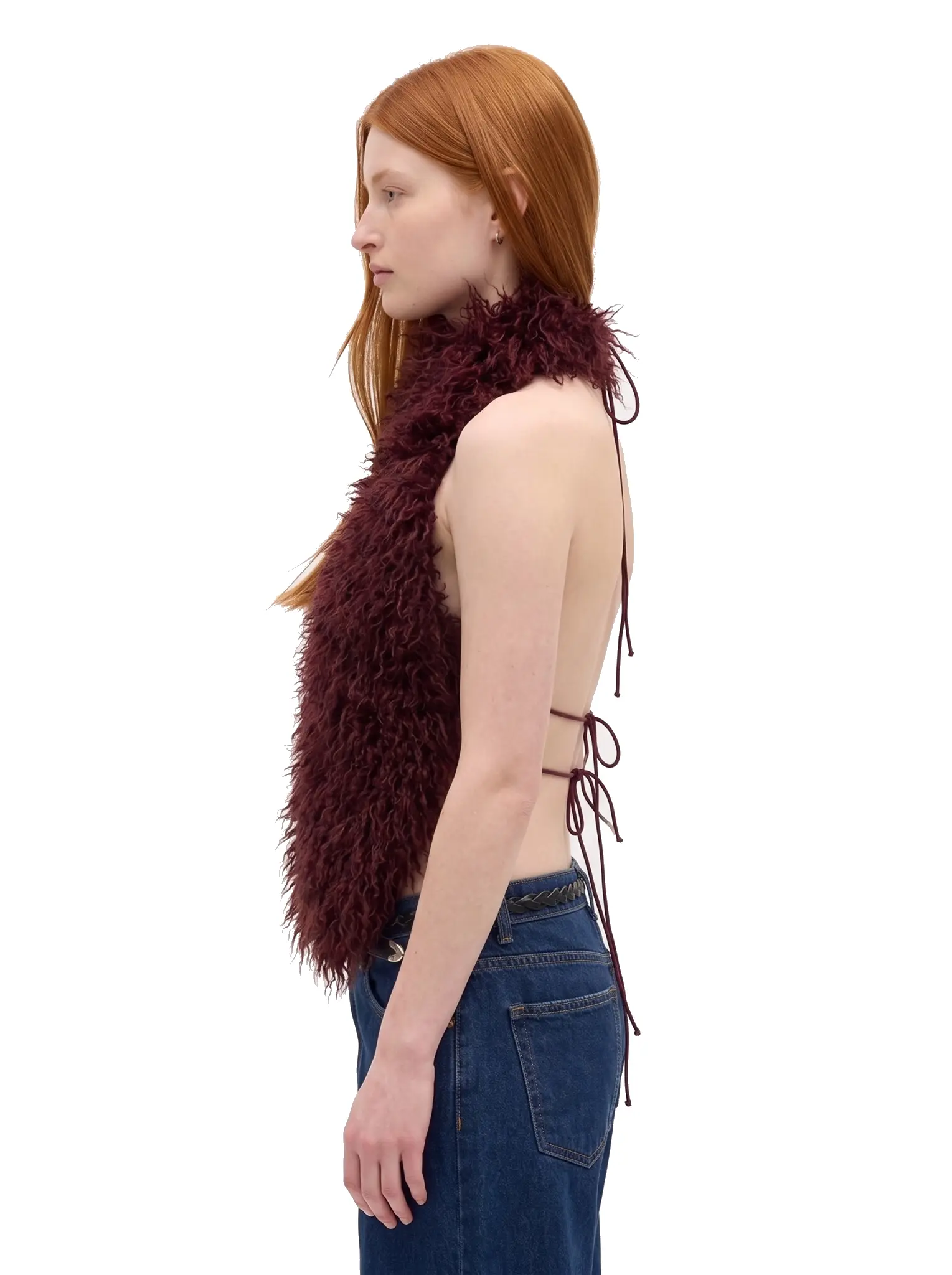 Three-quarter view of a woman wearing a maroon faux fur halter vest with adjustable tie straps