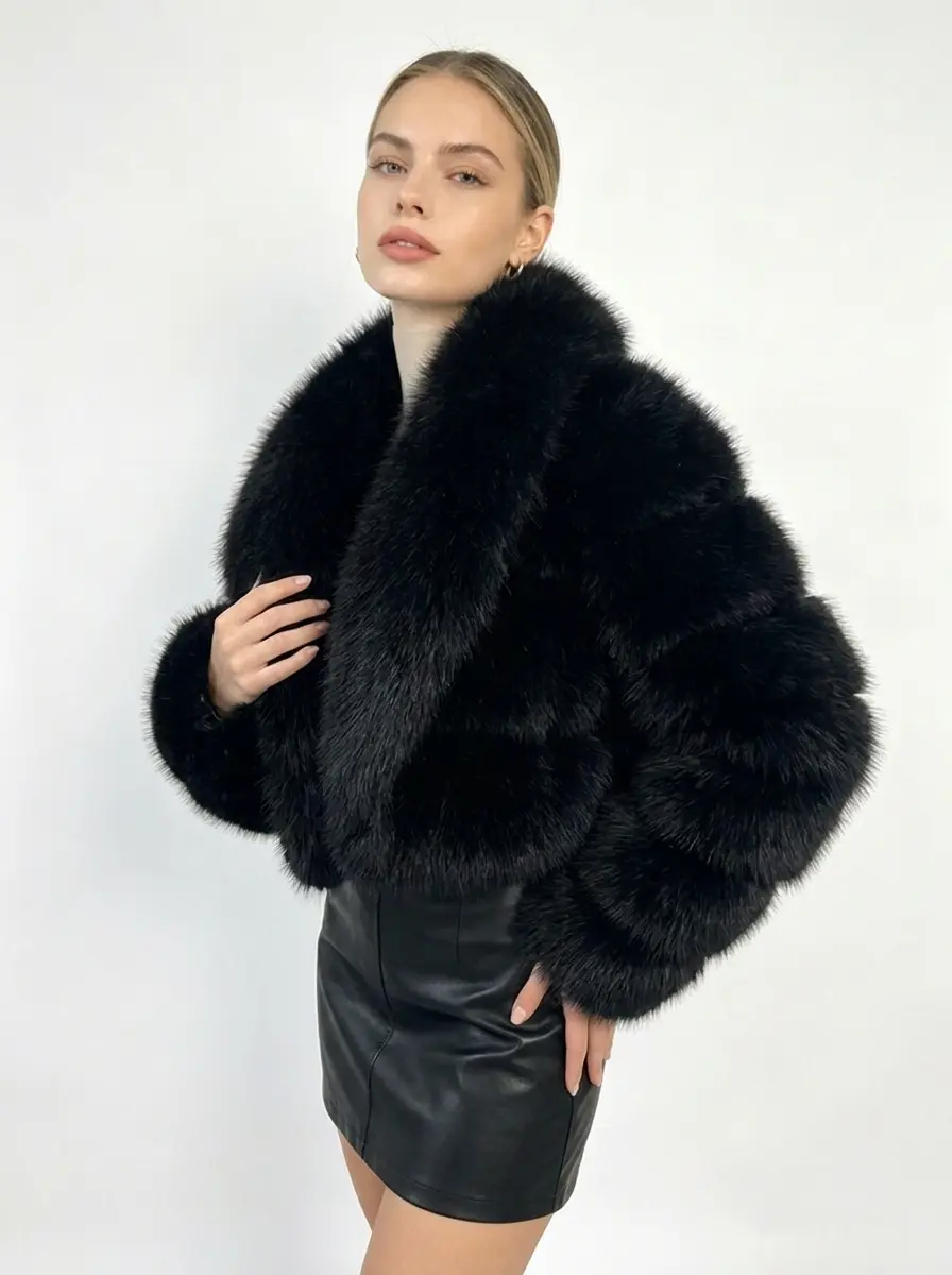 Woman wearing black short oversized lapel faux fur jacket, three-quarter front view