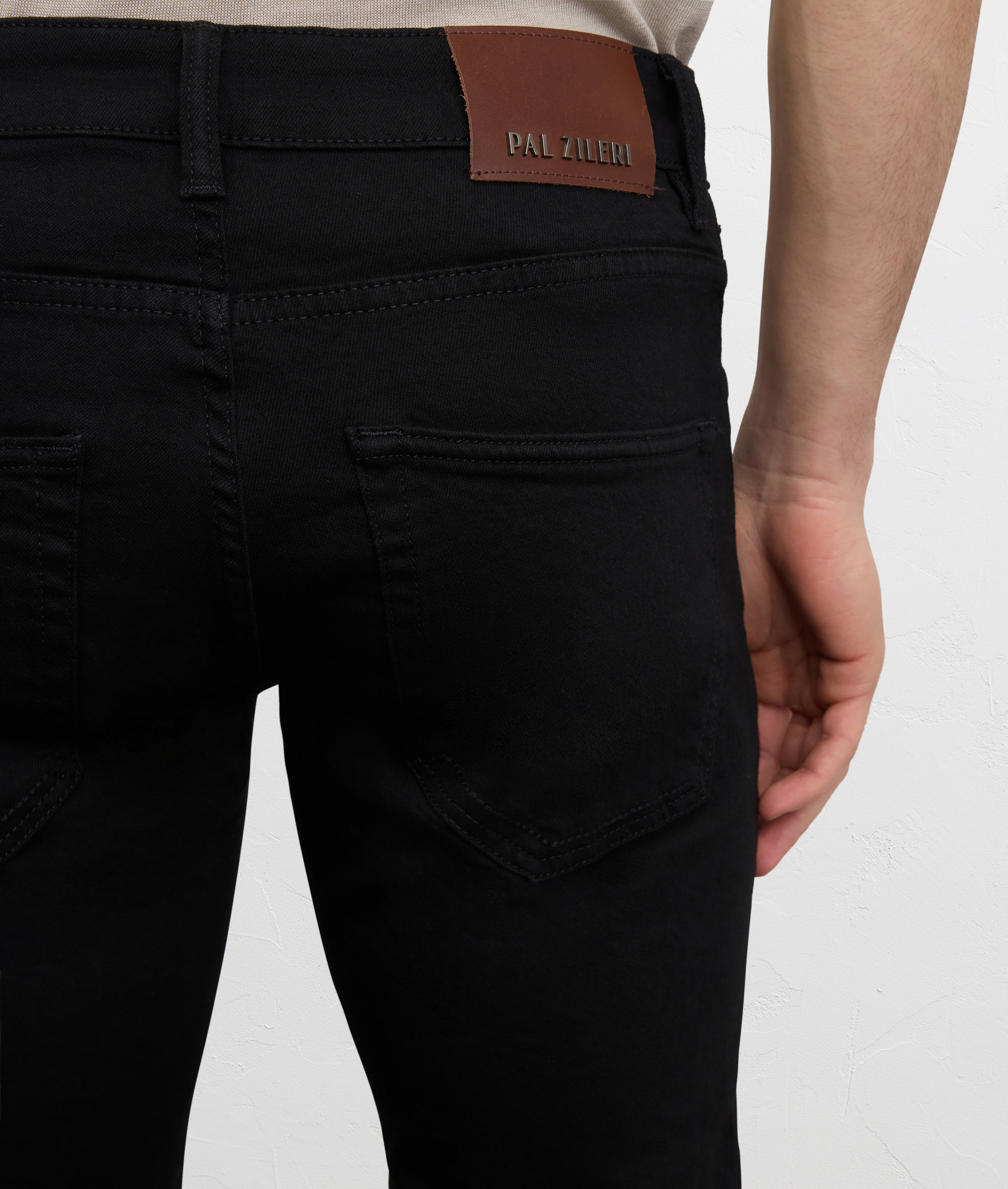 BLACK COTTON AND ELASTANE DENIM WITH LEATHER BADGE AND METAL LOGO