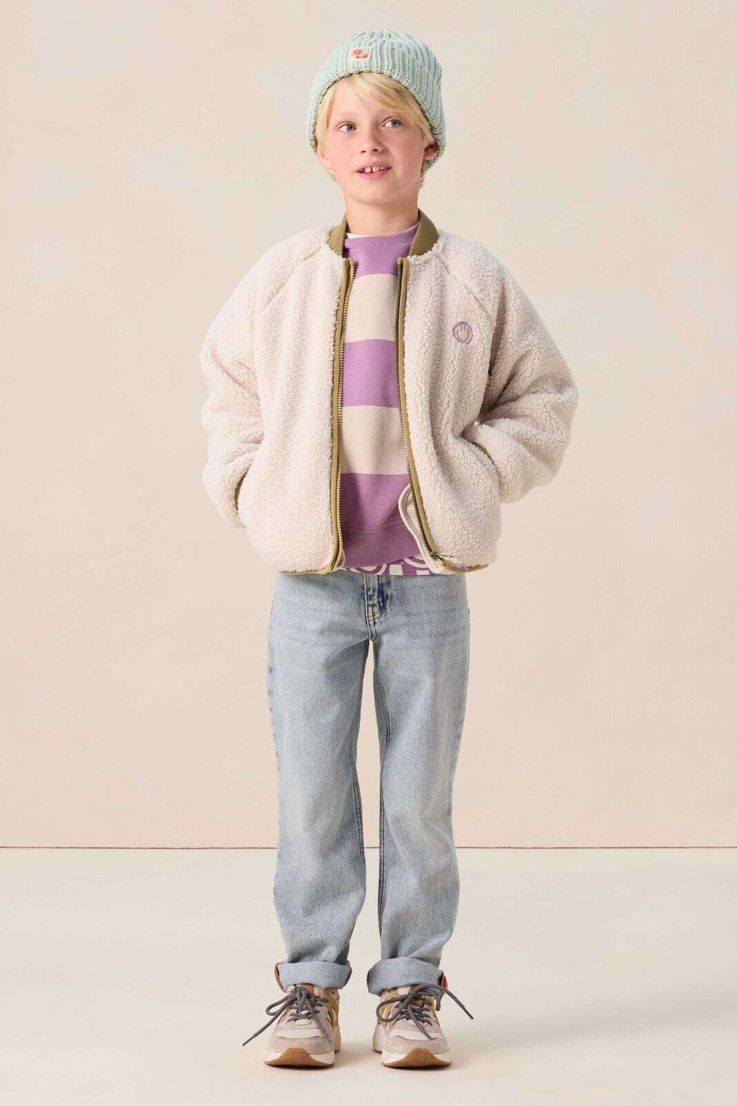 Witte teddy jas met smiley