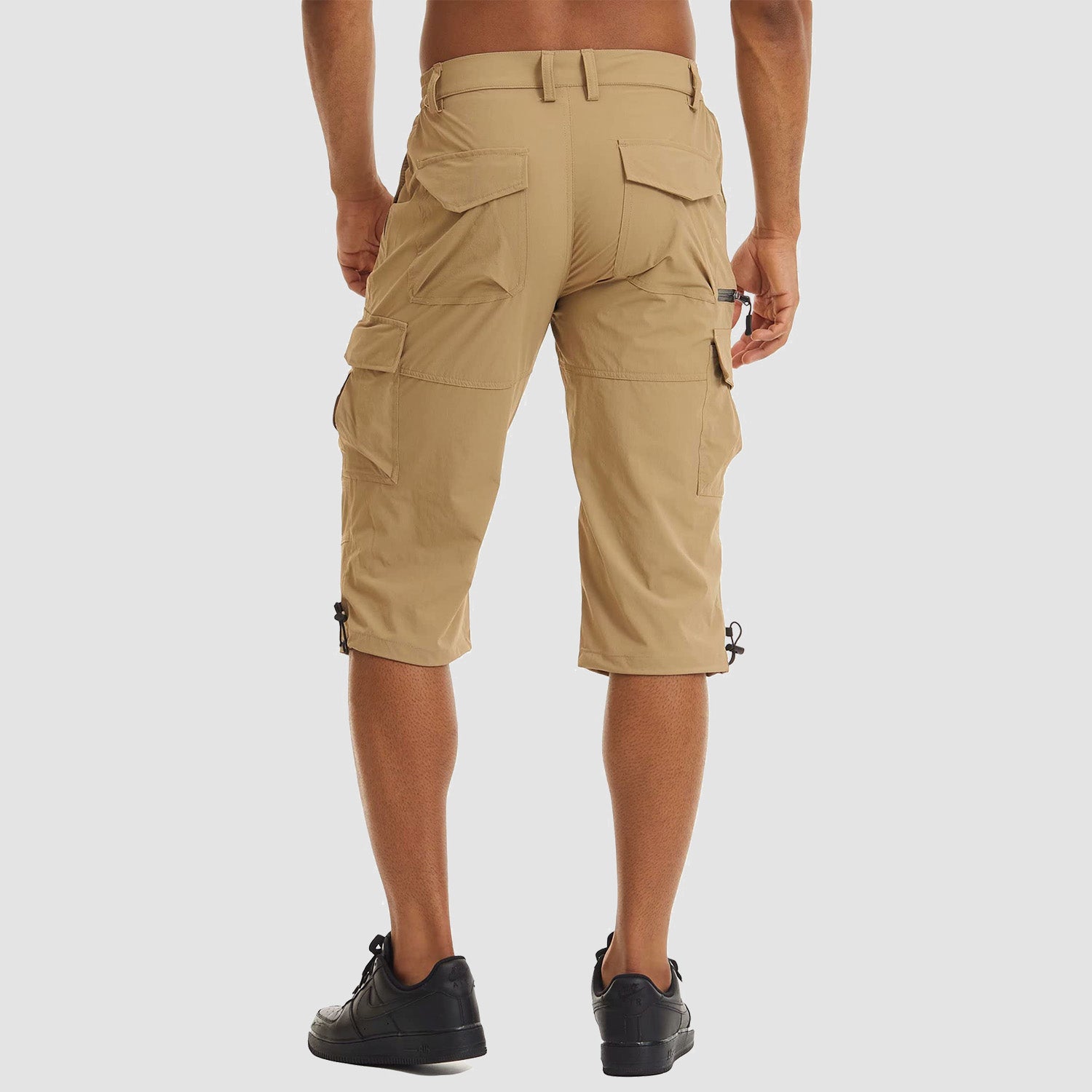 Short de sport pour homme avec 7 poches, séchage rapide, coupe 3/4 capri, idéal pour la randonnée.