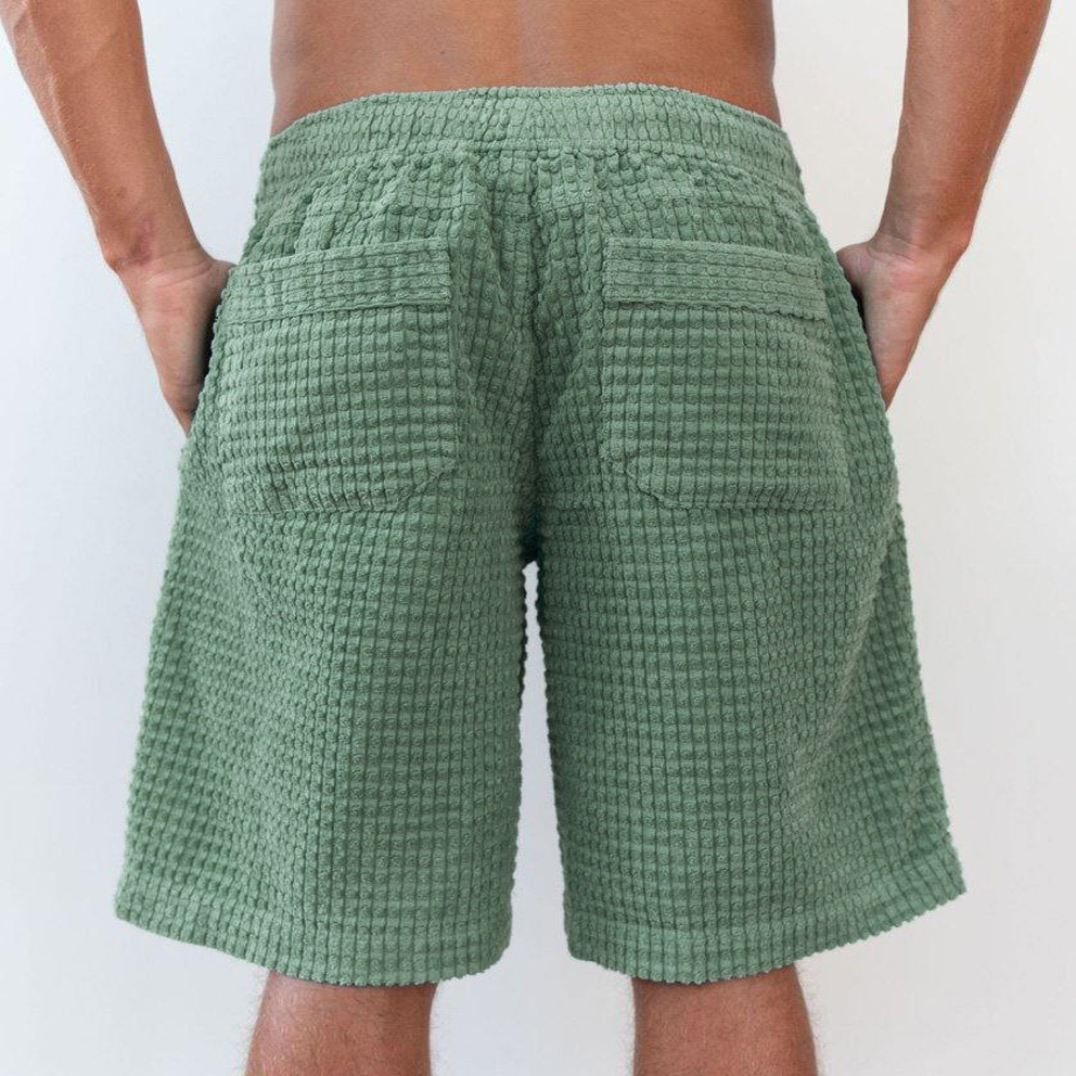 Short de surf vintage pour homme, idéal pour les vacances.