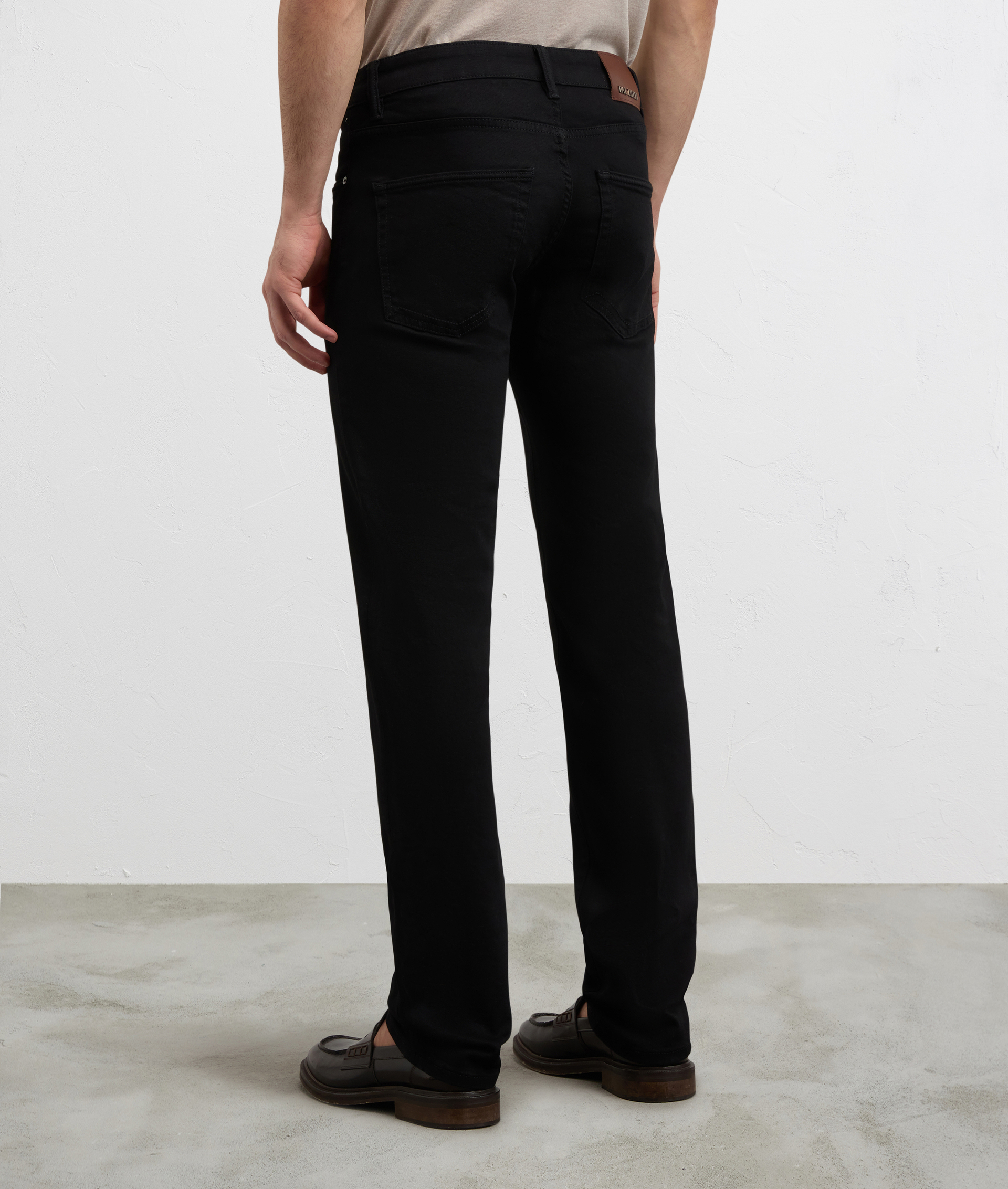 BLACK COTTON AND ELASTANE DENIM WITH LEATHER BADGE AND METAL LOGO