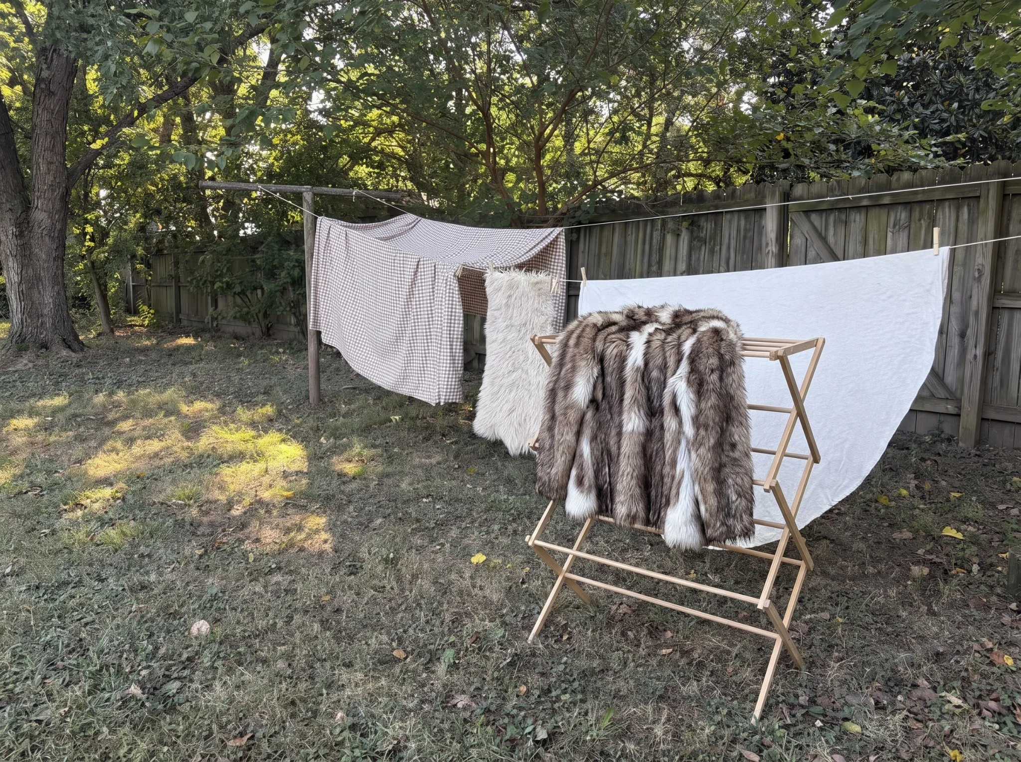 Faux fur coat drying on an outdoor rack