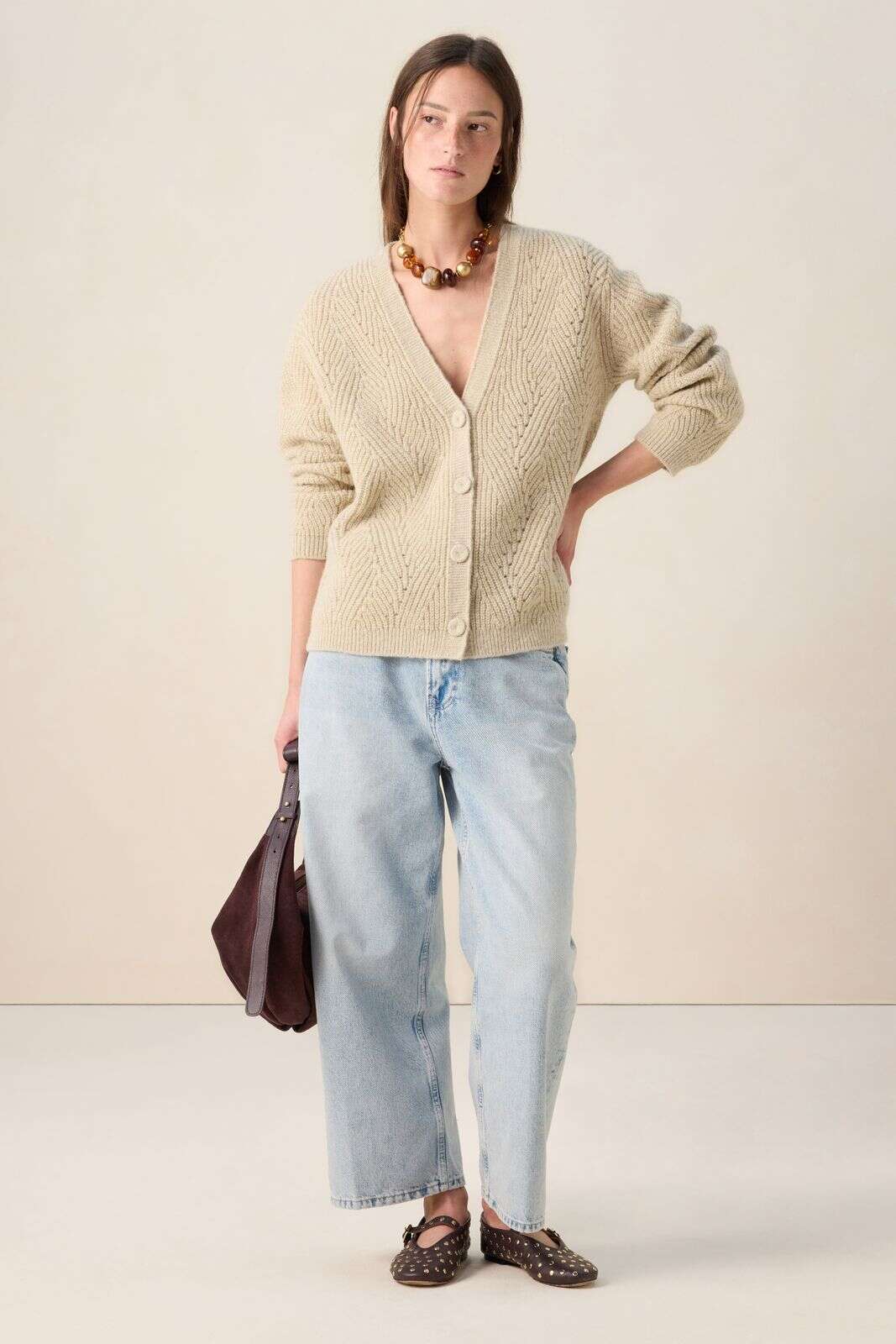 Wit gebreid lurex vest