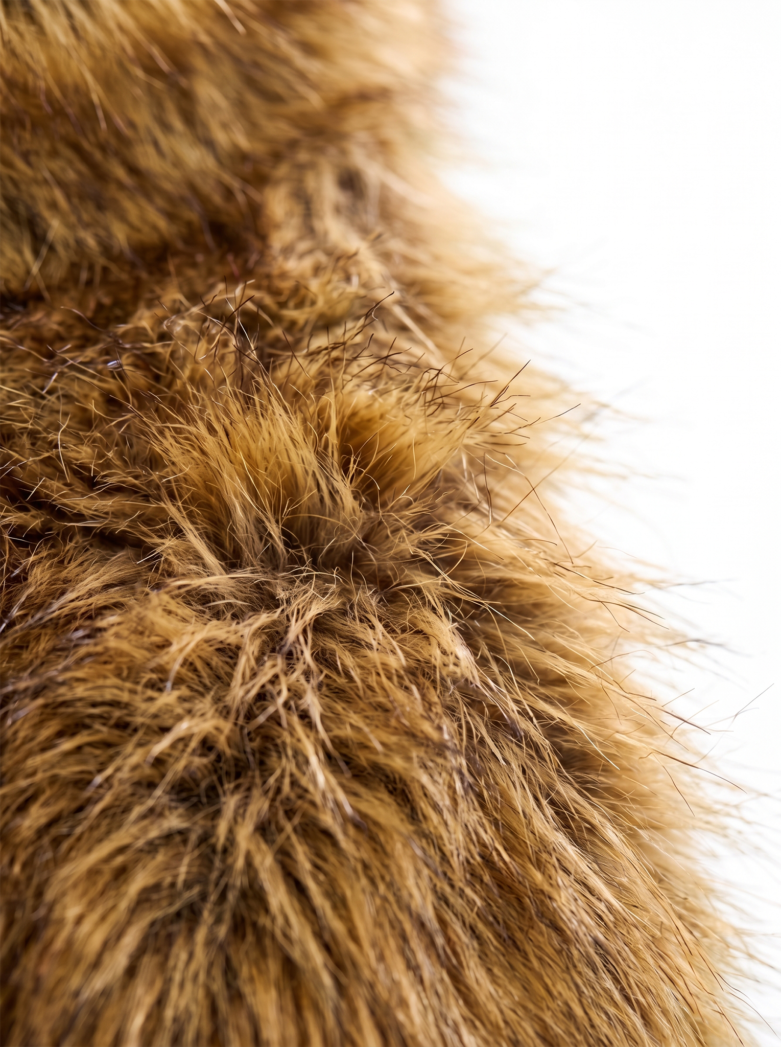 Close-up of the soft brown faux fur texture on the vest