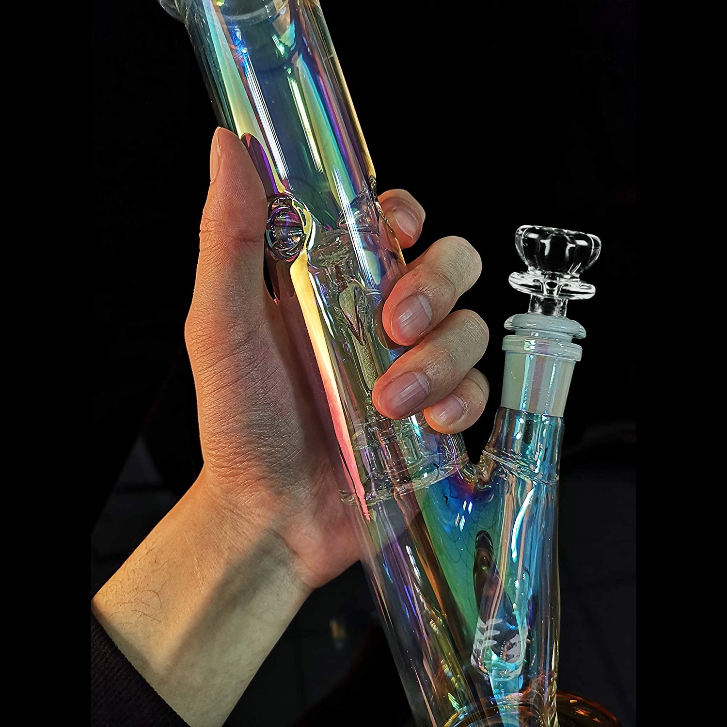 Hand holding the 12-inch glow in the dark straight tube glass bong for scale