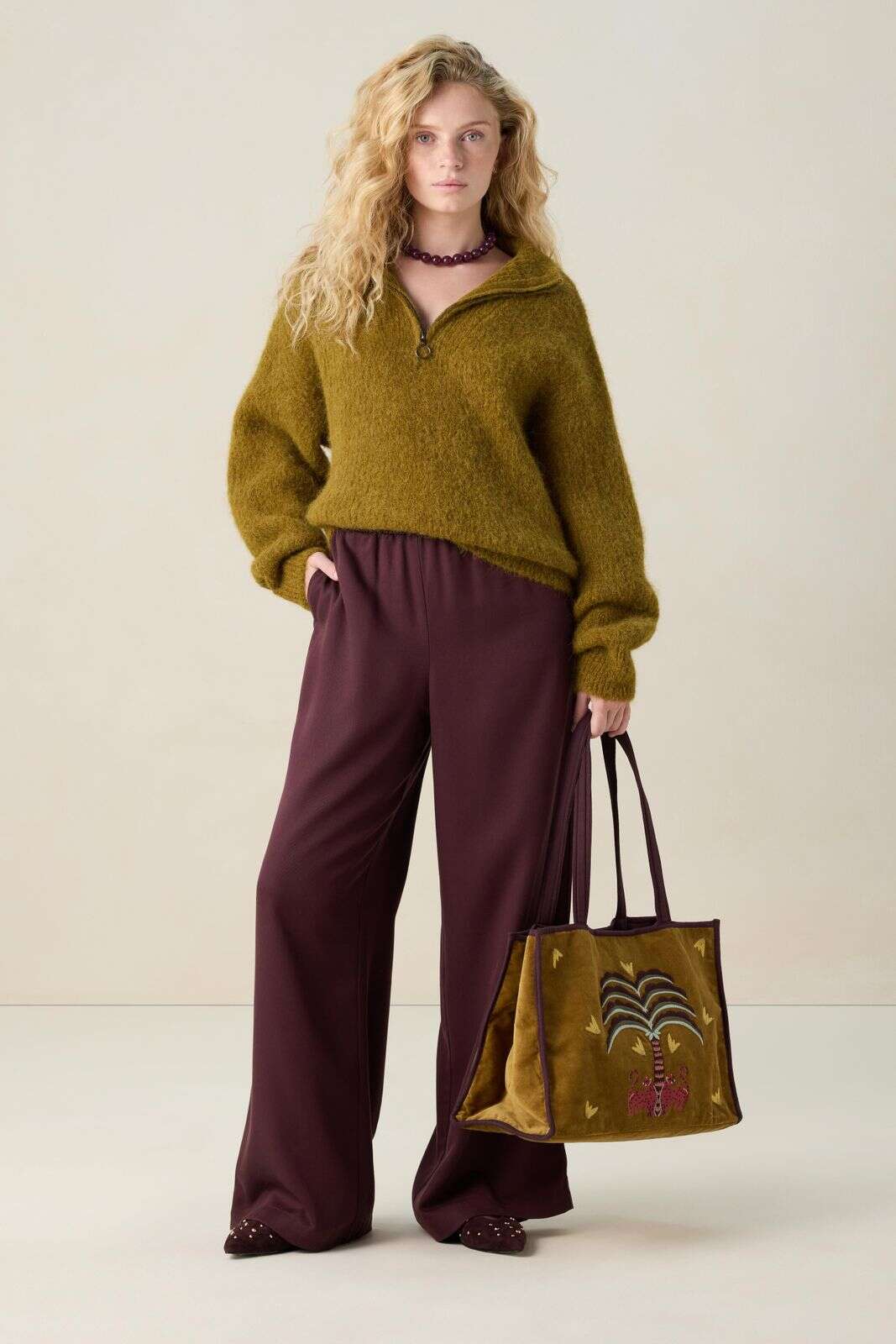 Donkergroene trui met rits