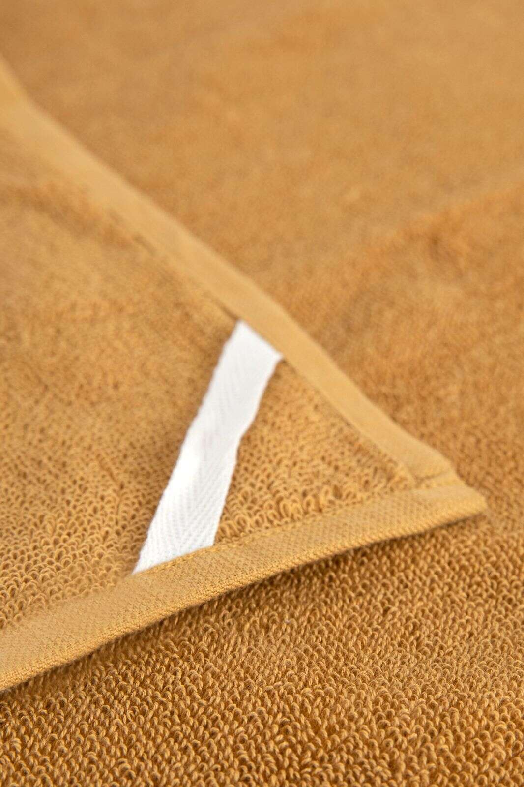 Donkergele handdoek en theedoek Terry