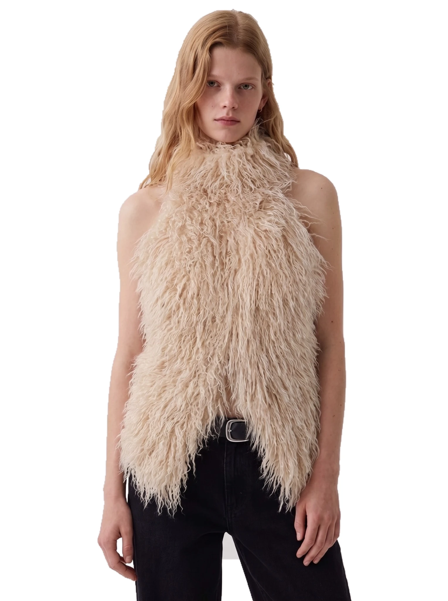 Front view of a woman wearing a beige shaggy faux fur halter top with black jeans.