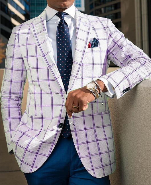 Blazer élégant à carreaux, revers cranté, poches et deux boutons