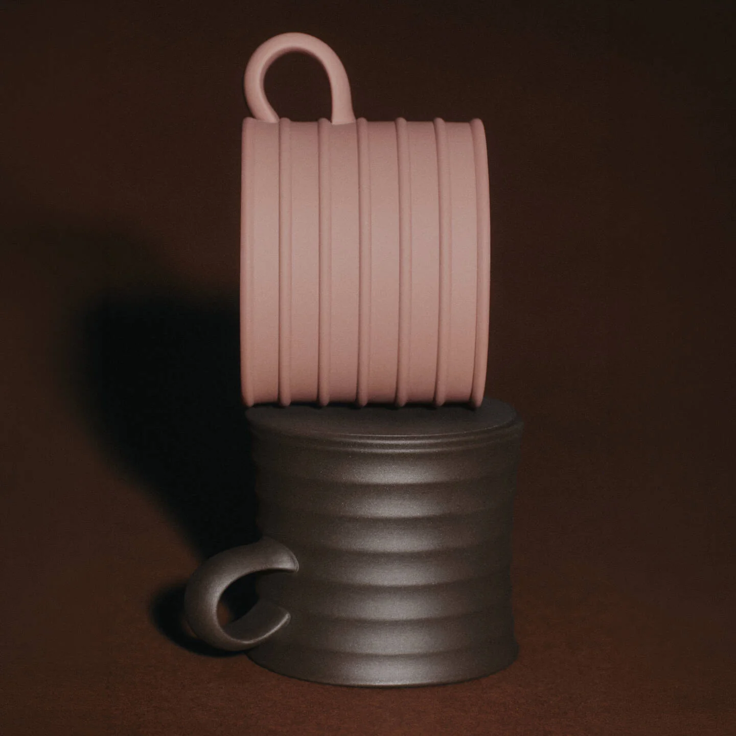 JW Anderson Mug Pair Dark Brown / Teracotta - Two ribbed JW Anderson jasperware mugs stacked vertically on a dark brown background. The top mug is a dusty pink color, and the bottom mug is a dark brown.