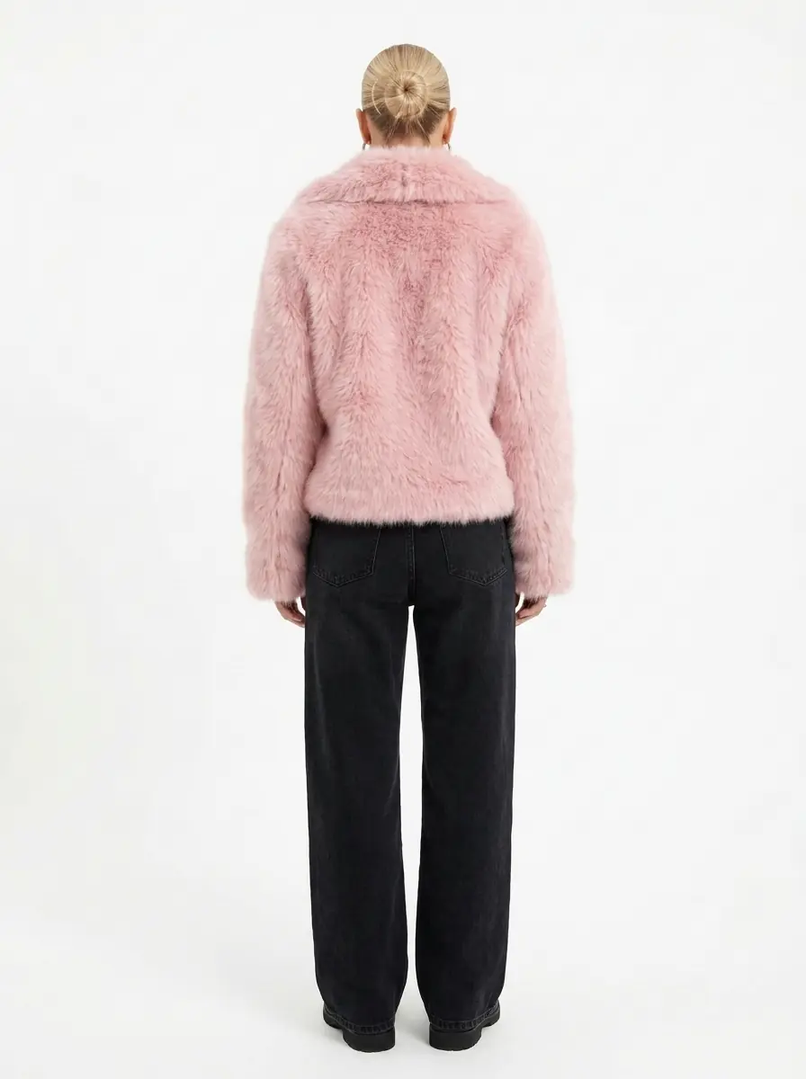 Back view of a women's pink faux fur jacket