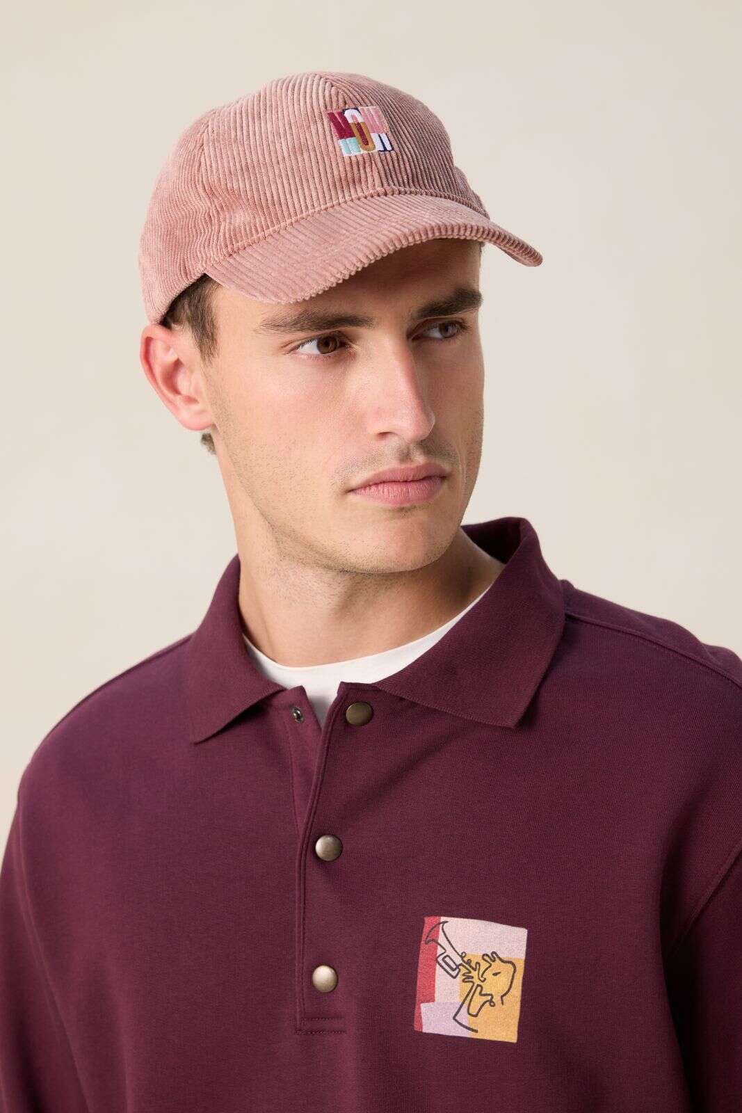 Roze corduroy pet met artwork