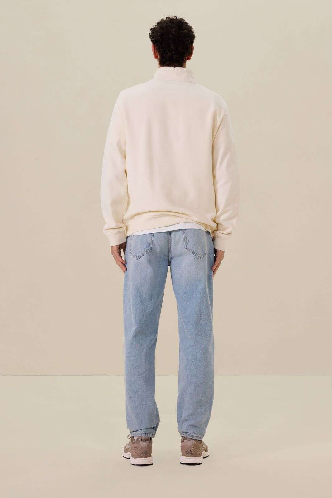 Witte sweater met rits en artwork