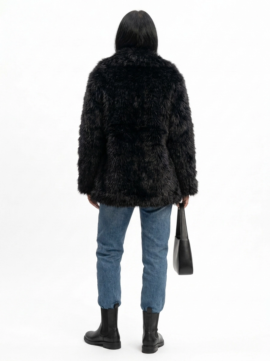 Back view of a women's black faux fur coat
