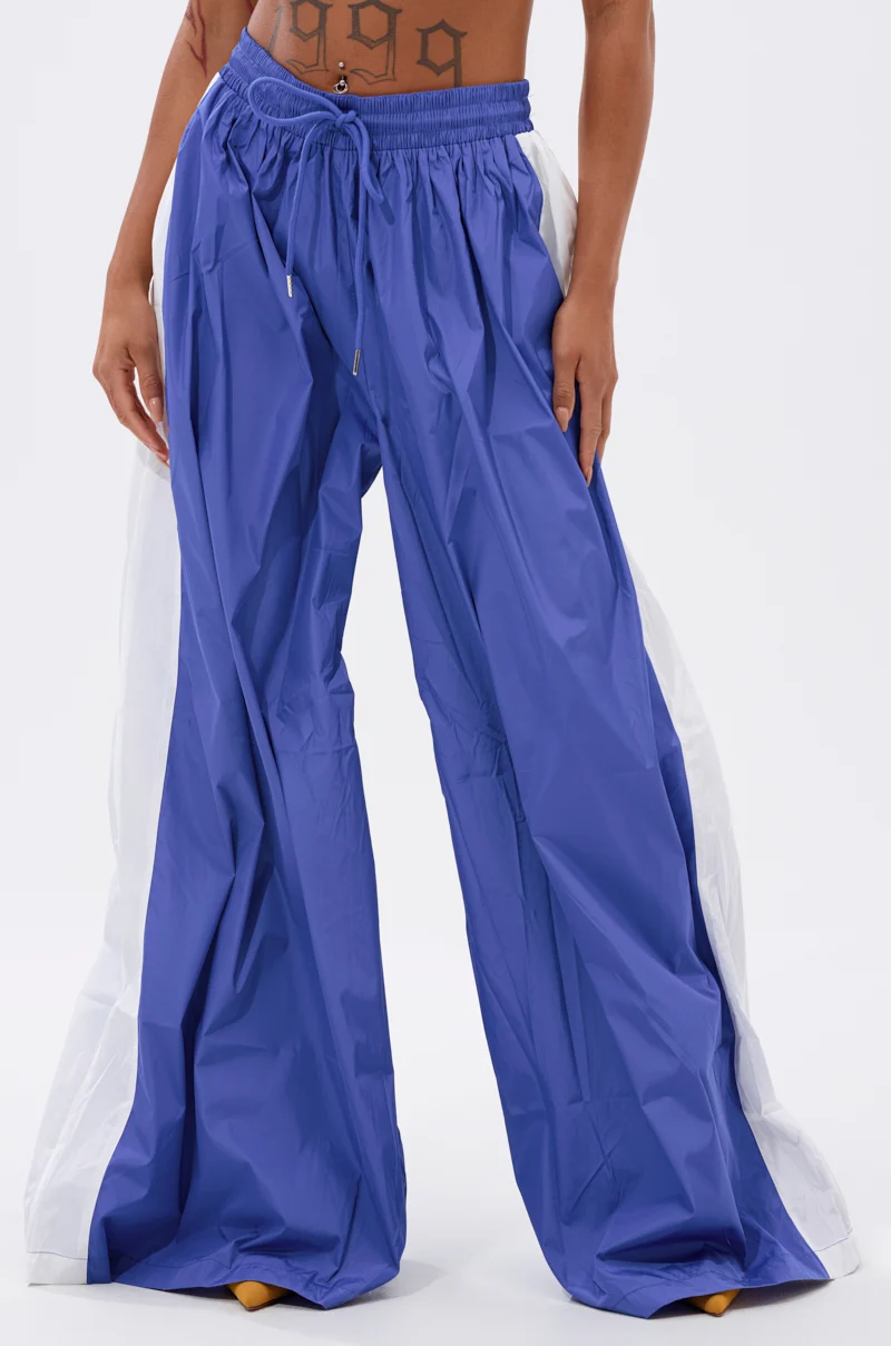 BREAKING THE RULES TRACK PANT IN ROYAL BLUE - Akira Store