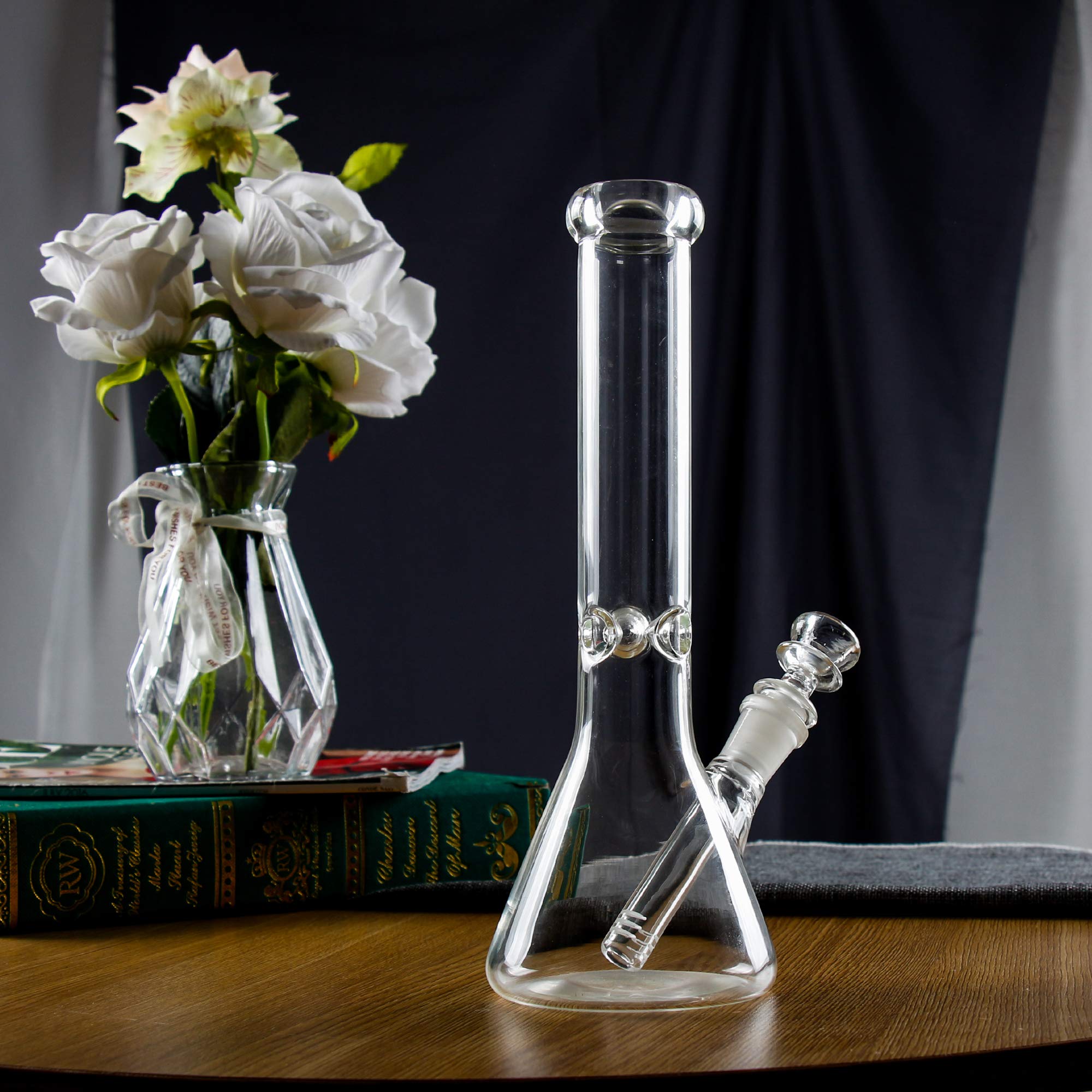 10-inch beaker glass bong with 14mm bowl on a tabletop with white roses and books