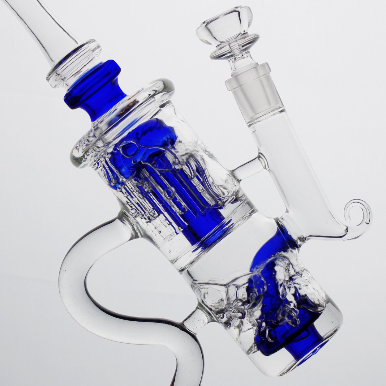 Close-up of the slotted glass percolator inside the upper chamber of the blue recycler bong