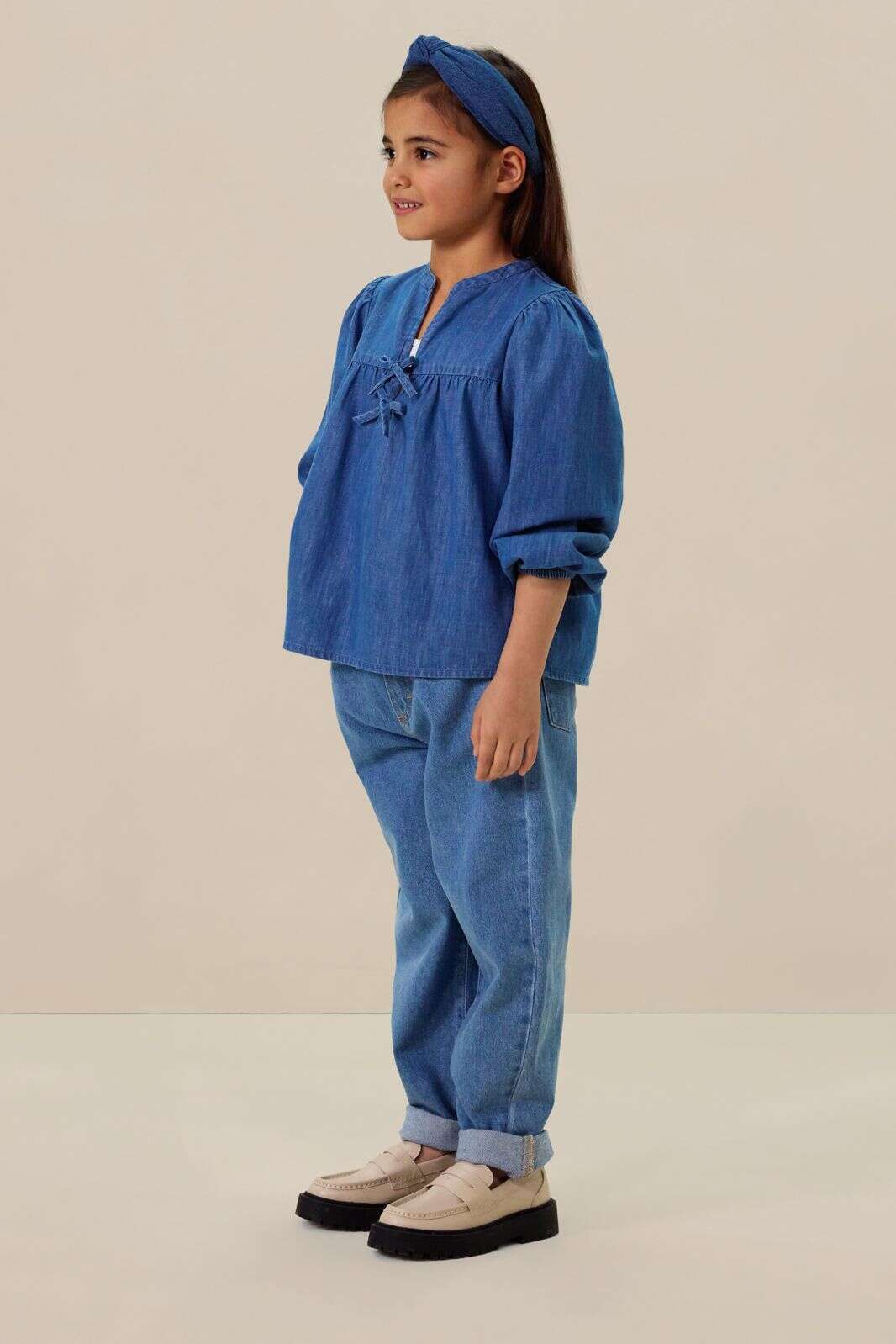 Blauwe denim blouse met strikjes