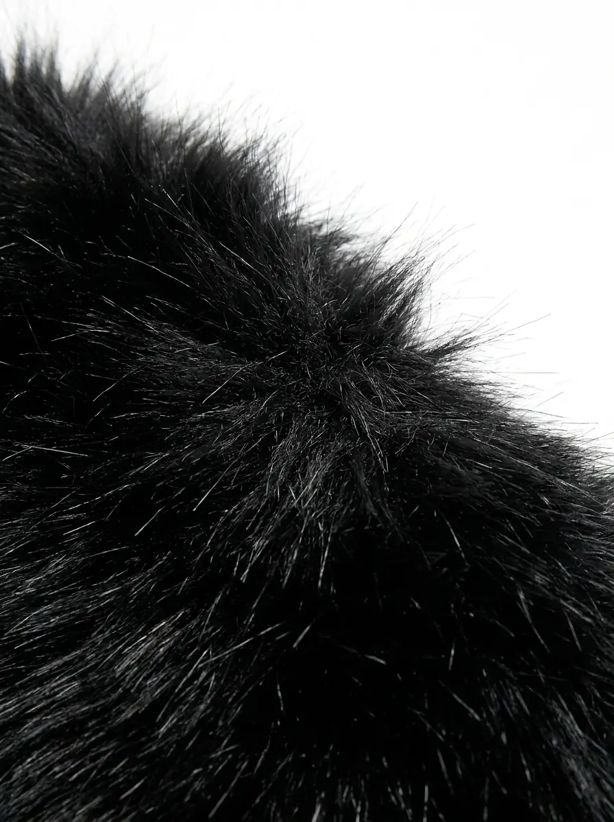 Close-up of soft black faux fur vest texture