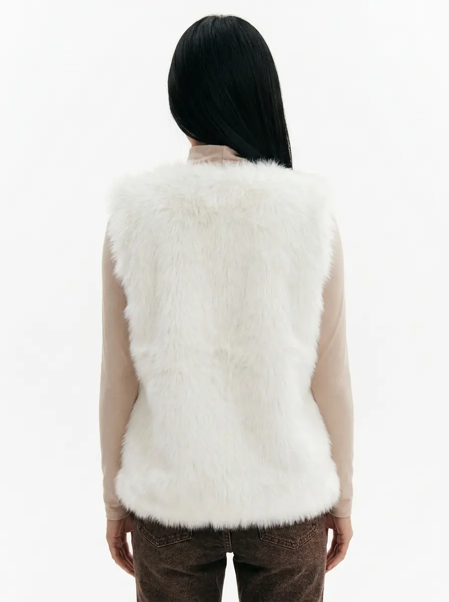 Back view of a women's white faux fur vest