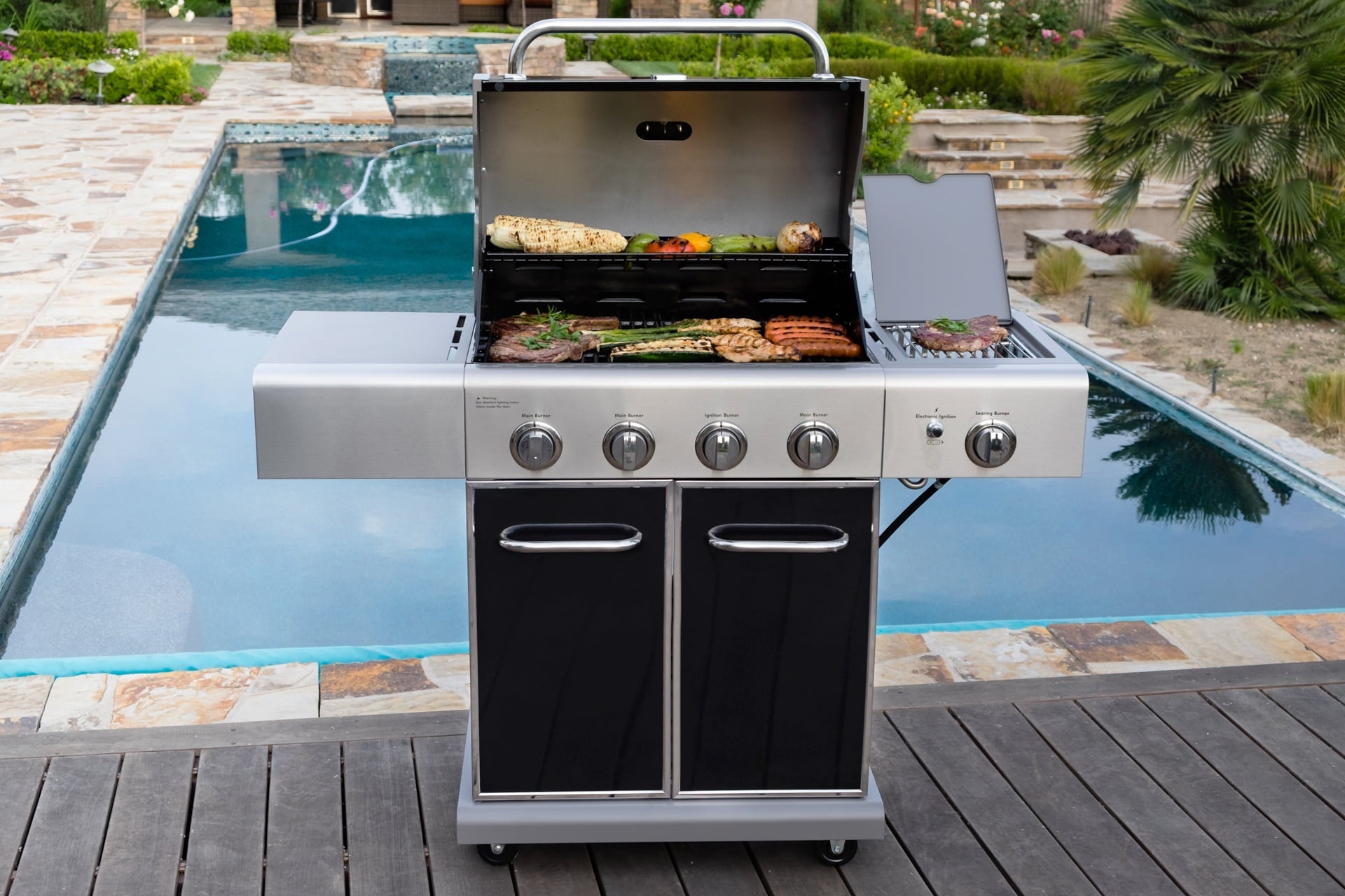 4-Burner Outdoor Propane Gas Grill with Searing Side Burner. Stainless Steel with Black Trim