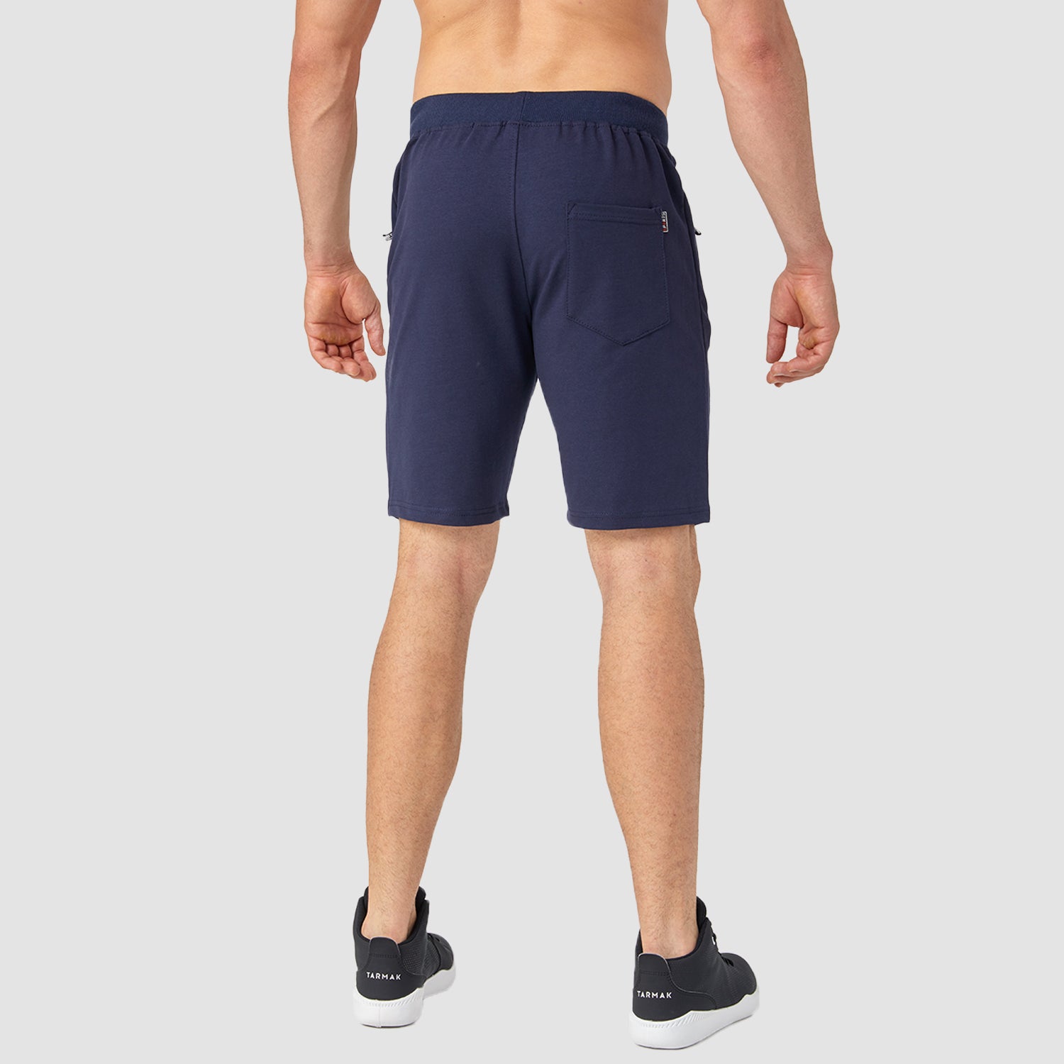 Short de sport en coton pour homme, idéal pour la course, la gym et le fitness. Taille élastique, poches zippées et cordon de serrage.