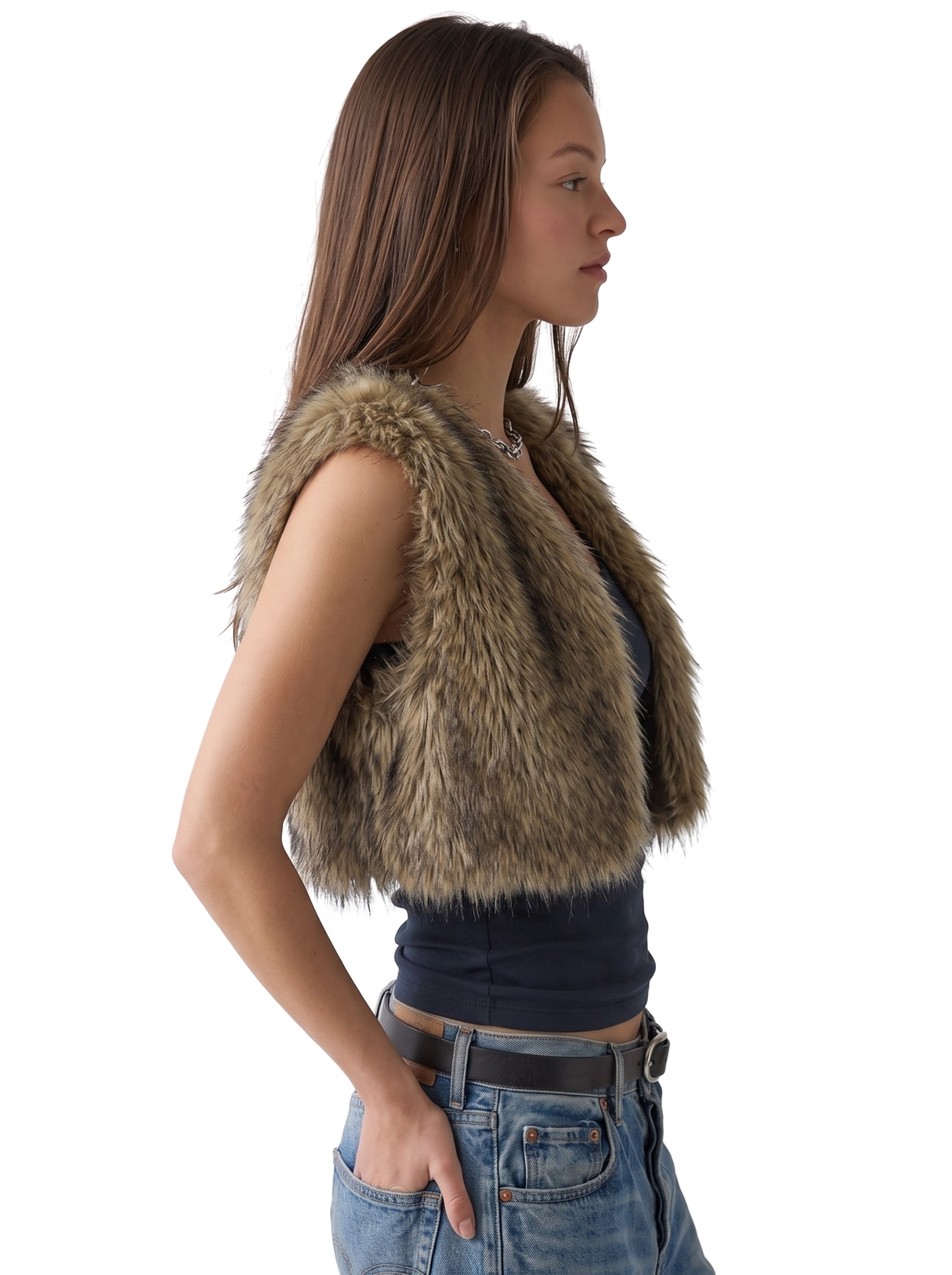 Side view of a woman wearing a brown faux fur vest with jeans