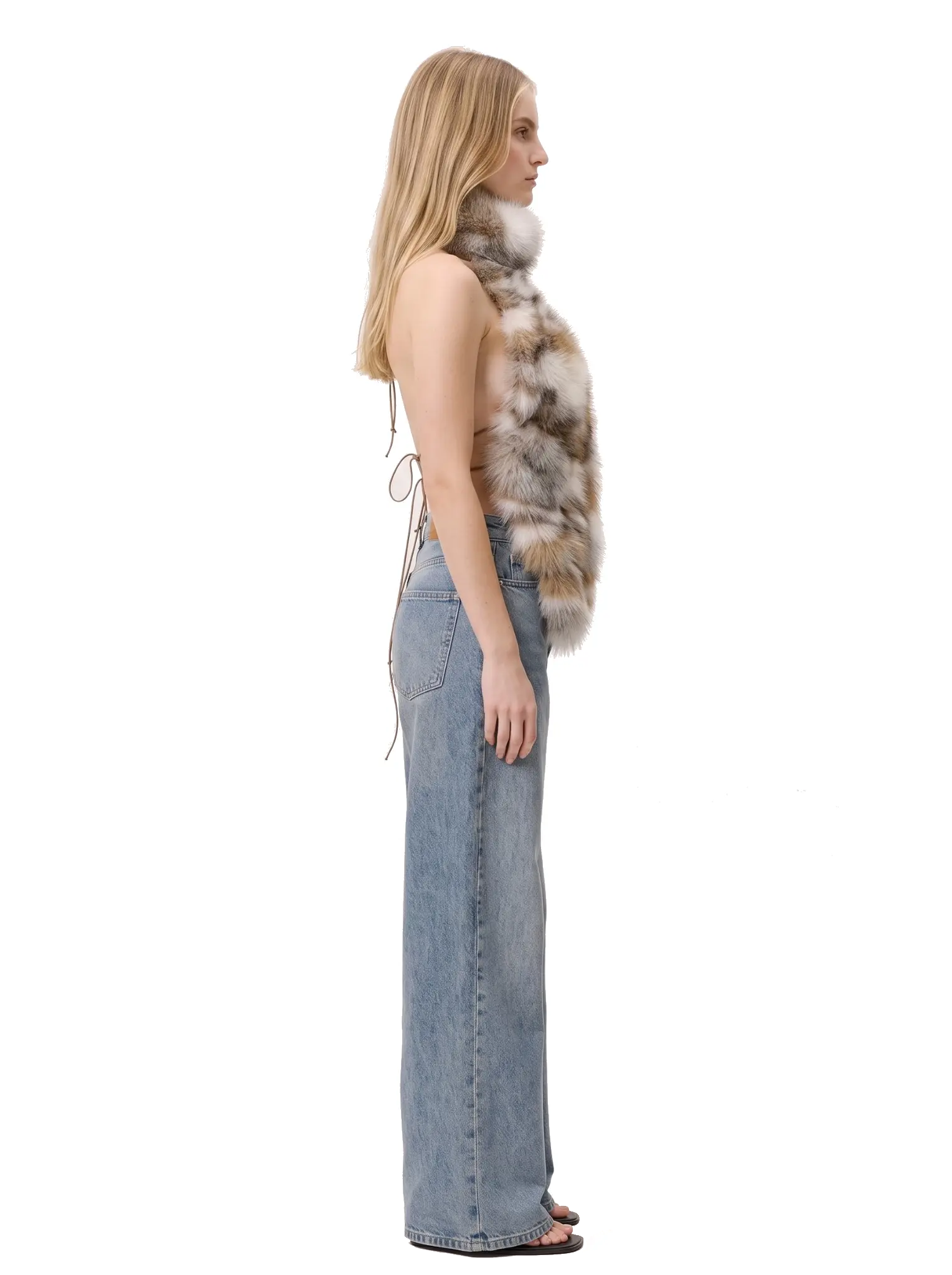Right-side profile of a woman wearing a multicolor spotted faux fur halter vest