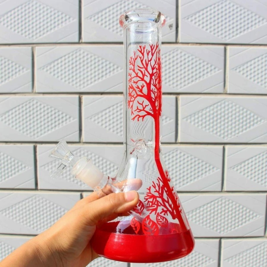Hand holding the 10-inch red tree beaker glass bong to show its size