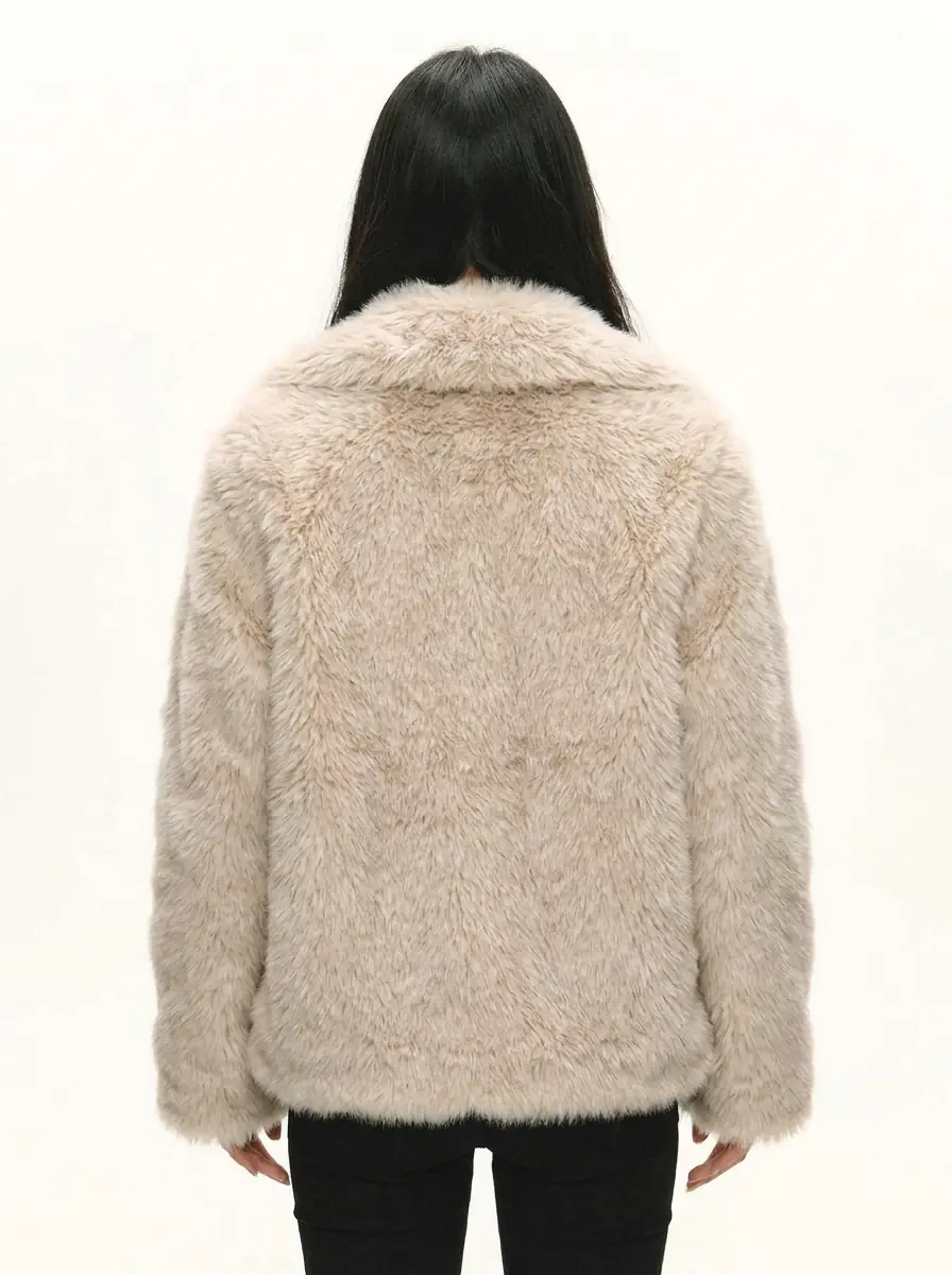 Back view of a women's beige faux fur jacket