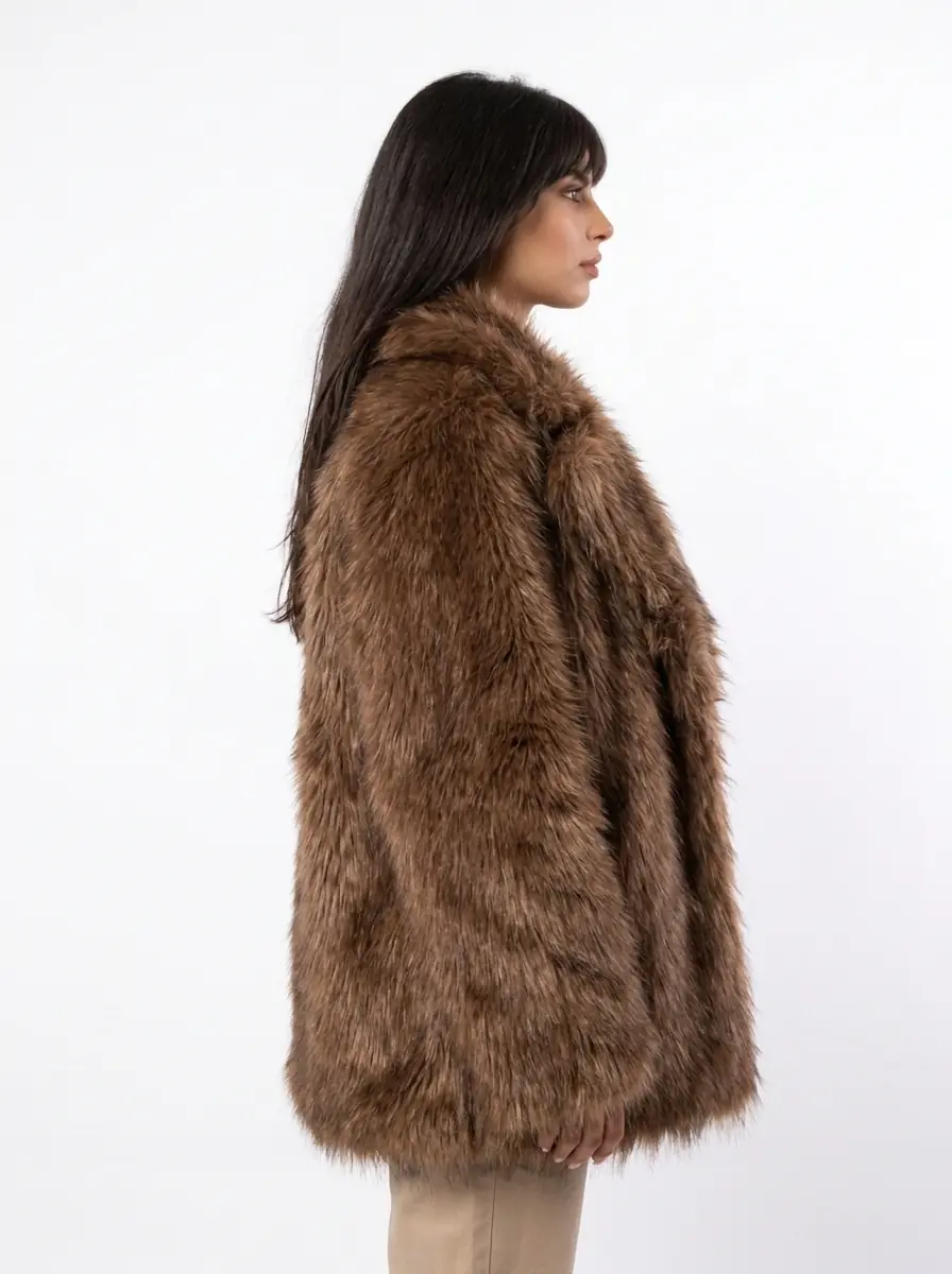 Side view of a women's light brown faux fur coat