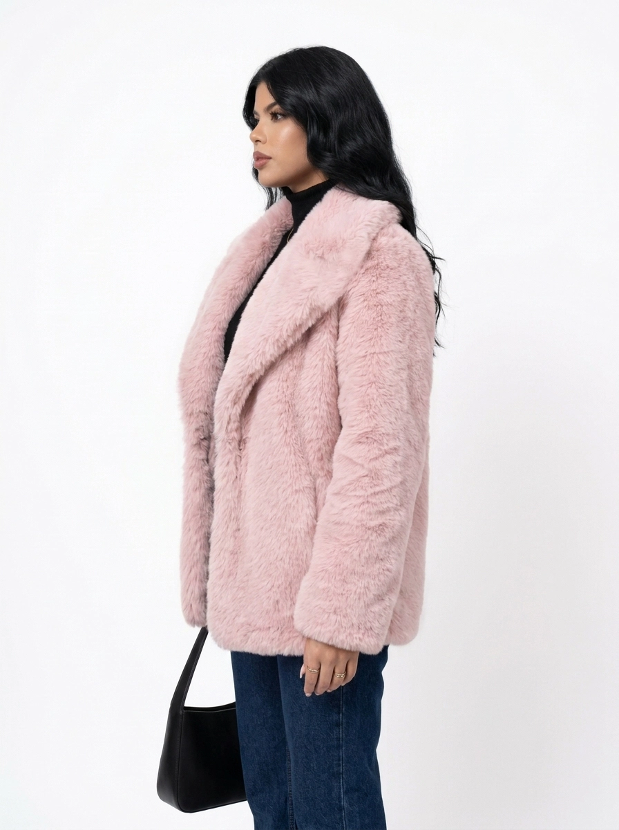 Side view of a woman wearing a pink faux fur coat