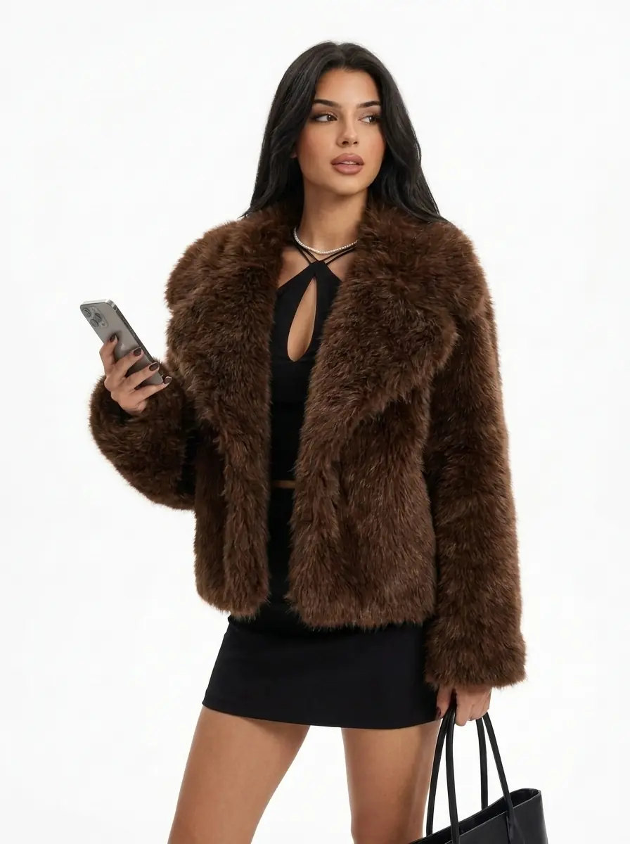 Woman wearing a brown faux fur jacket in a three-quarter view