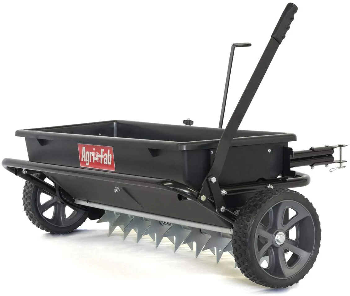 Semoir/épandeur à gravité tracté de 45 kg pour pelouse et jardin, idéal pour les semences, les engrais, le sel et le dégivrant ; conçu pour être tracté par les tracteurs de jardin.