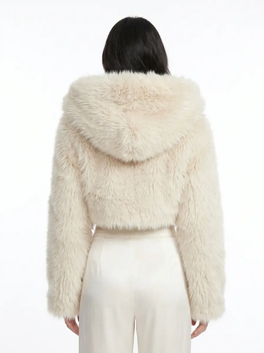 Back view of a women's cream hooded cropped faux fur jacket