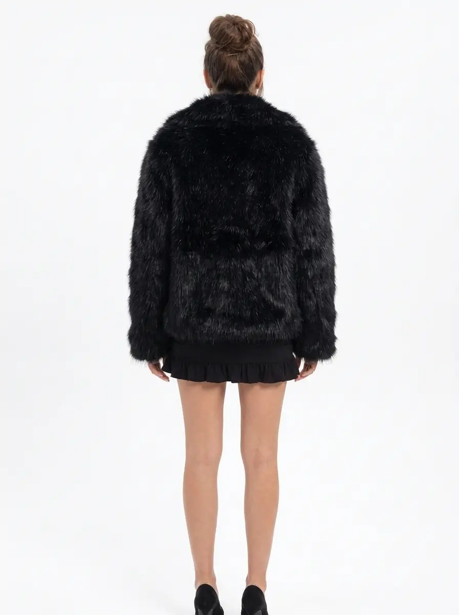 Back view of a women's black faux fur jacket