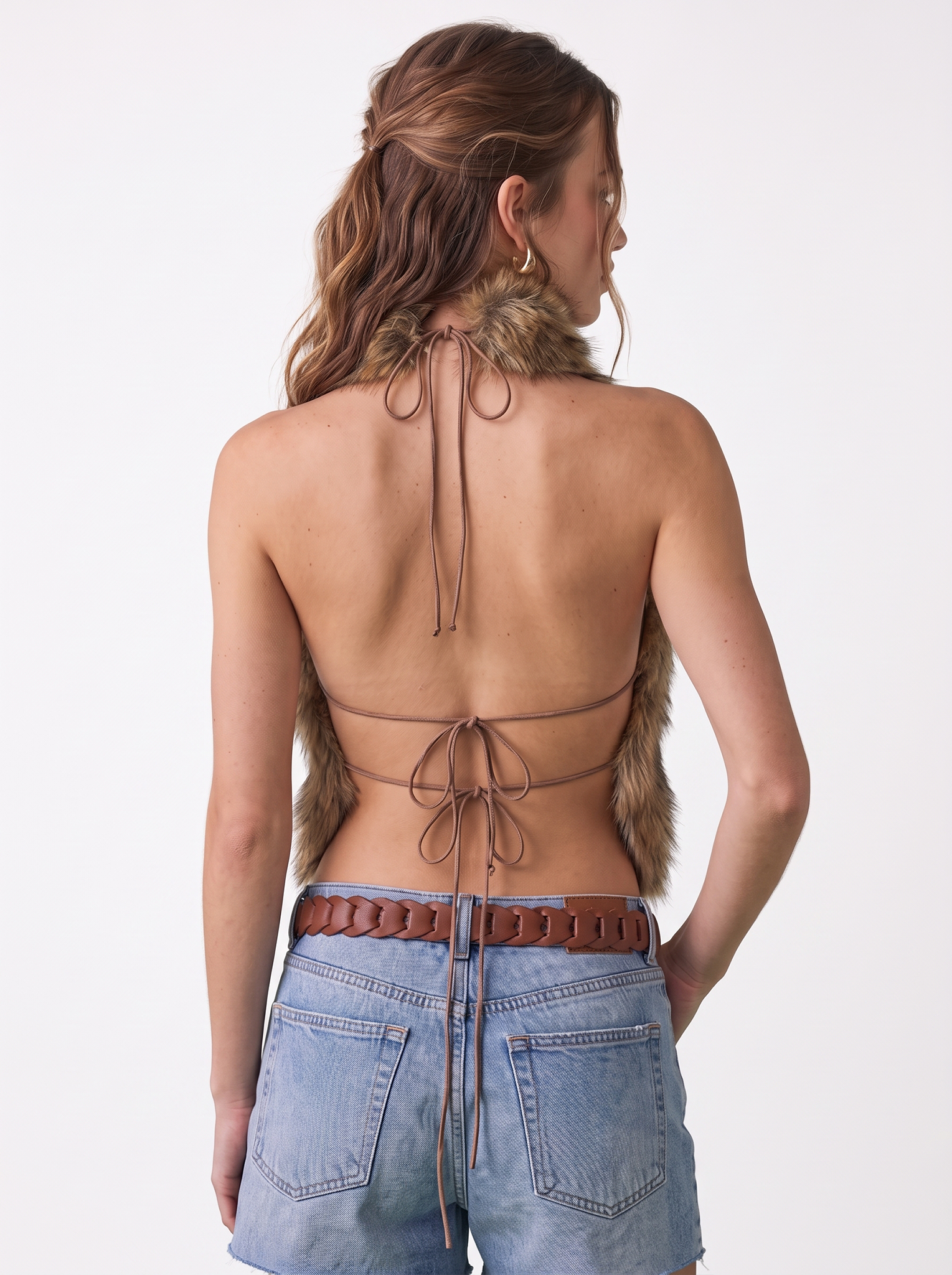 Back view of a woman wearing a brown faux fur halter vest
