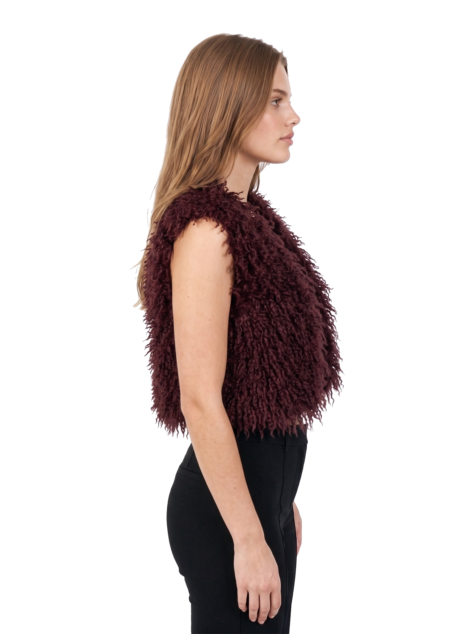 Side view of a woman styling a maroon faux fur vest with black pants