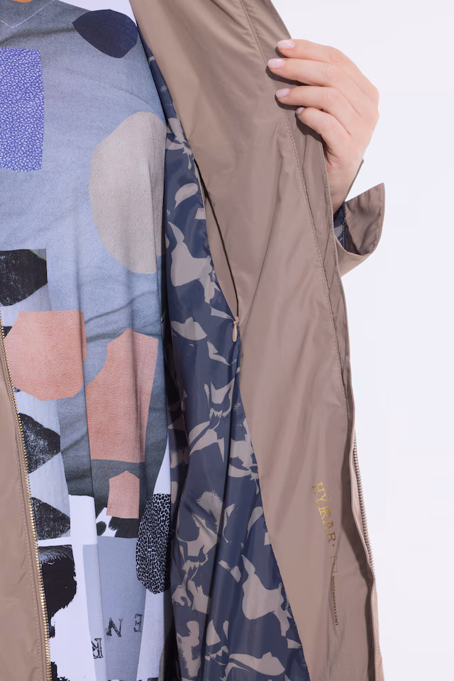 Curved Cross Seam Rain Coat