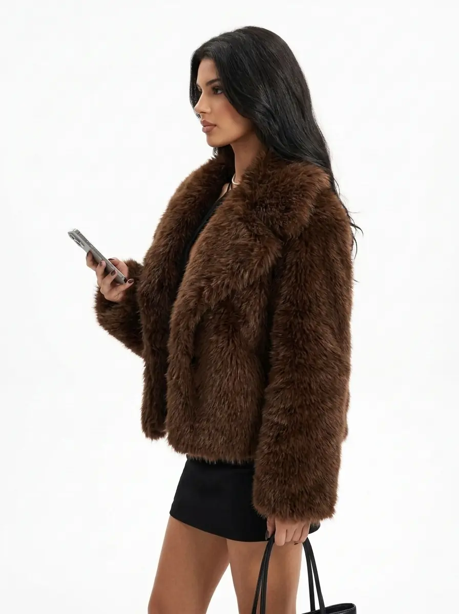 Side view of a woman wearing a brown faux fur jacket