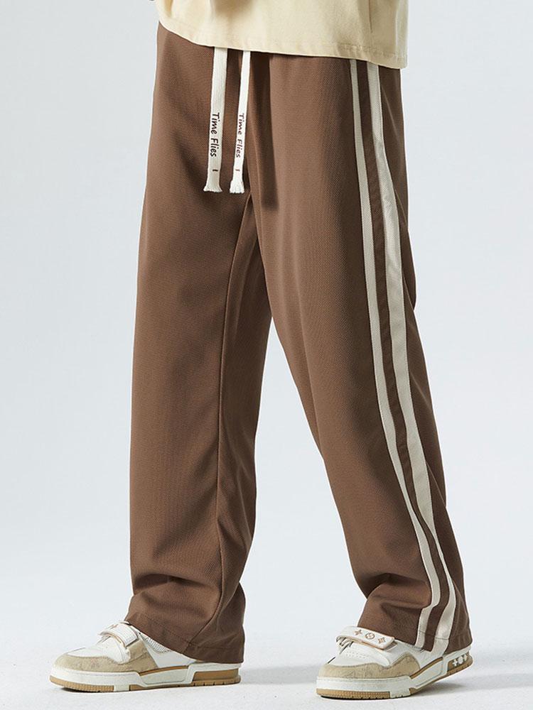 Pantalon vintage à rayures latérales, coupe ample et jambes droites