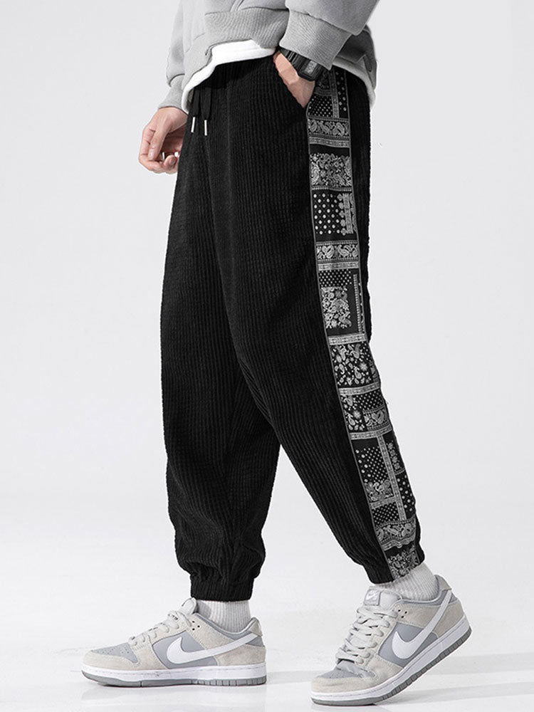 Pantalon à empiècements en velours côtelé imprimé cachemire