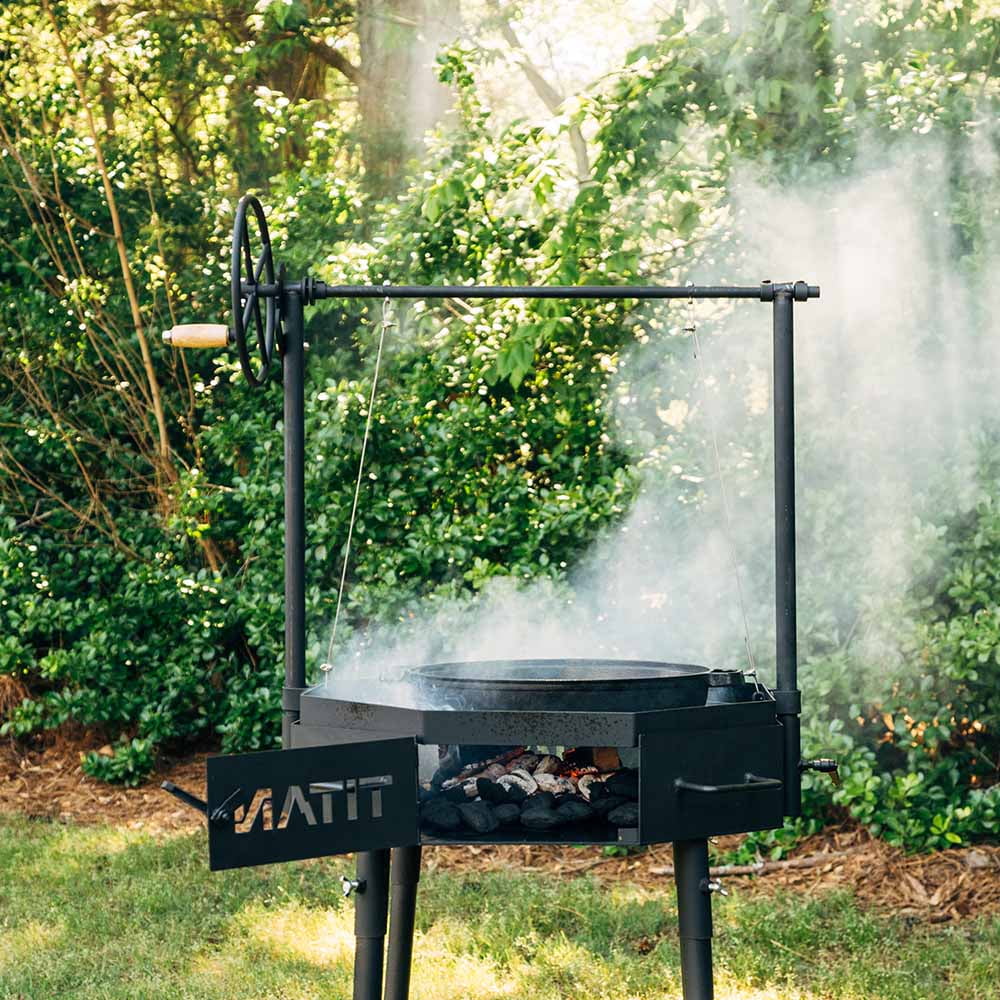 Ash & Ember Santa Maria Grill, Argentine Style Open Fire Grill, Adjustable Cooking Grate with Flywheel, BBQ Grill Comes with Cast Iron Skillet