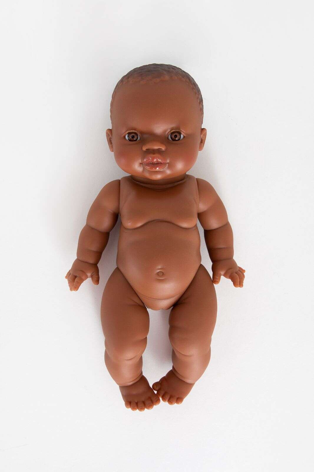 Pop met bruine ogen en zonder haar