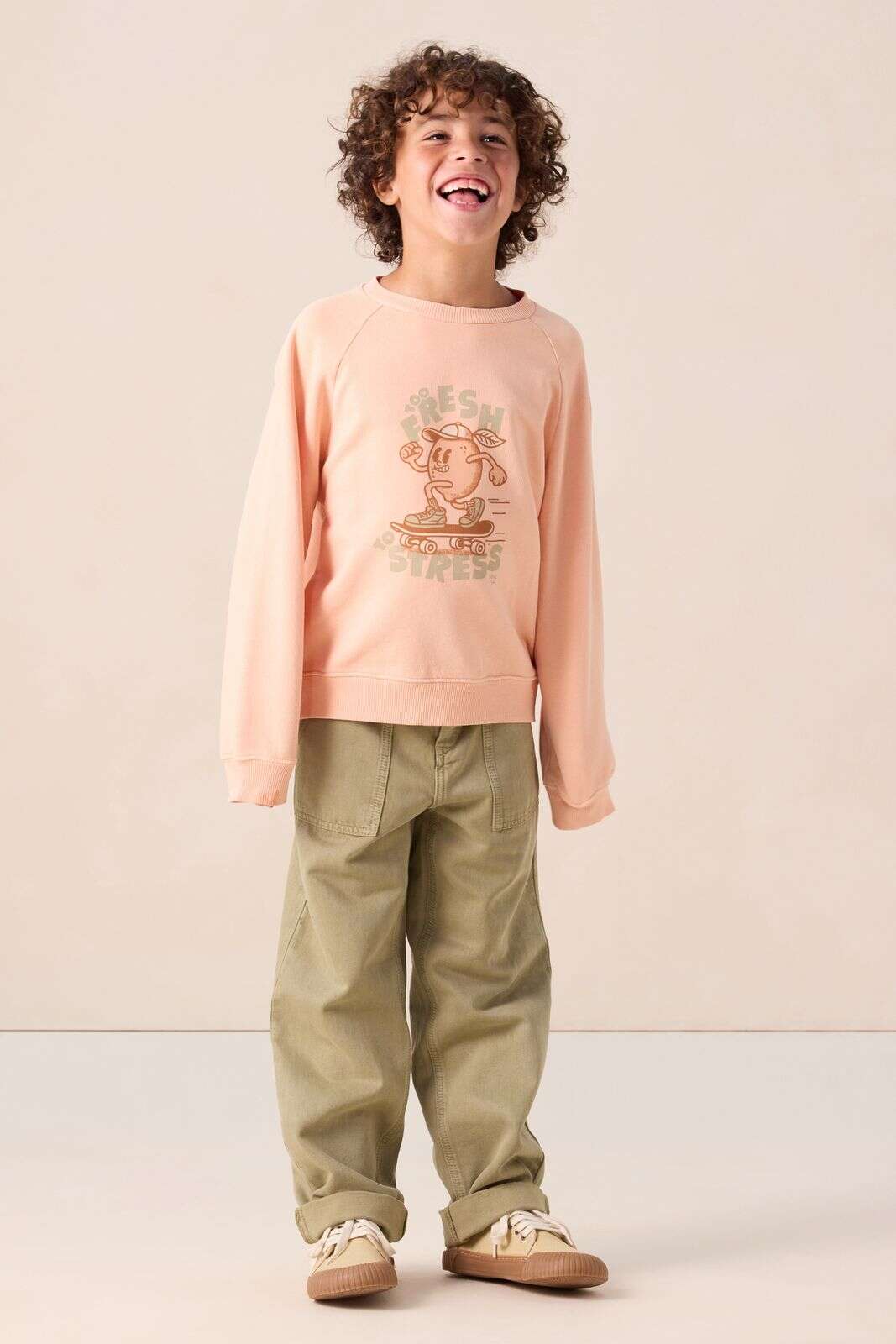 Lichtoranje sweater met print