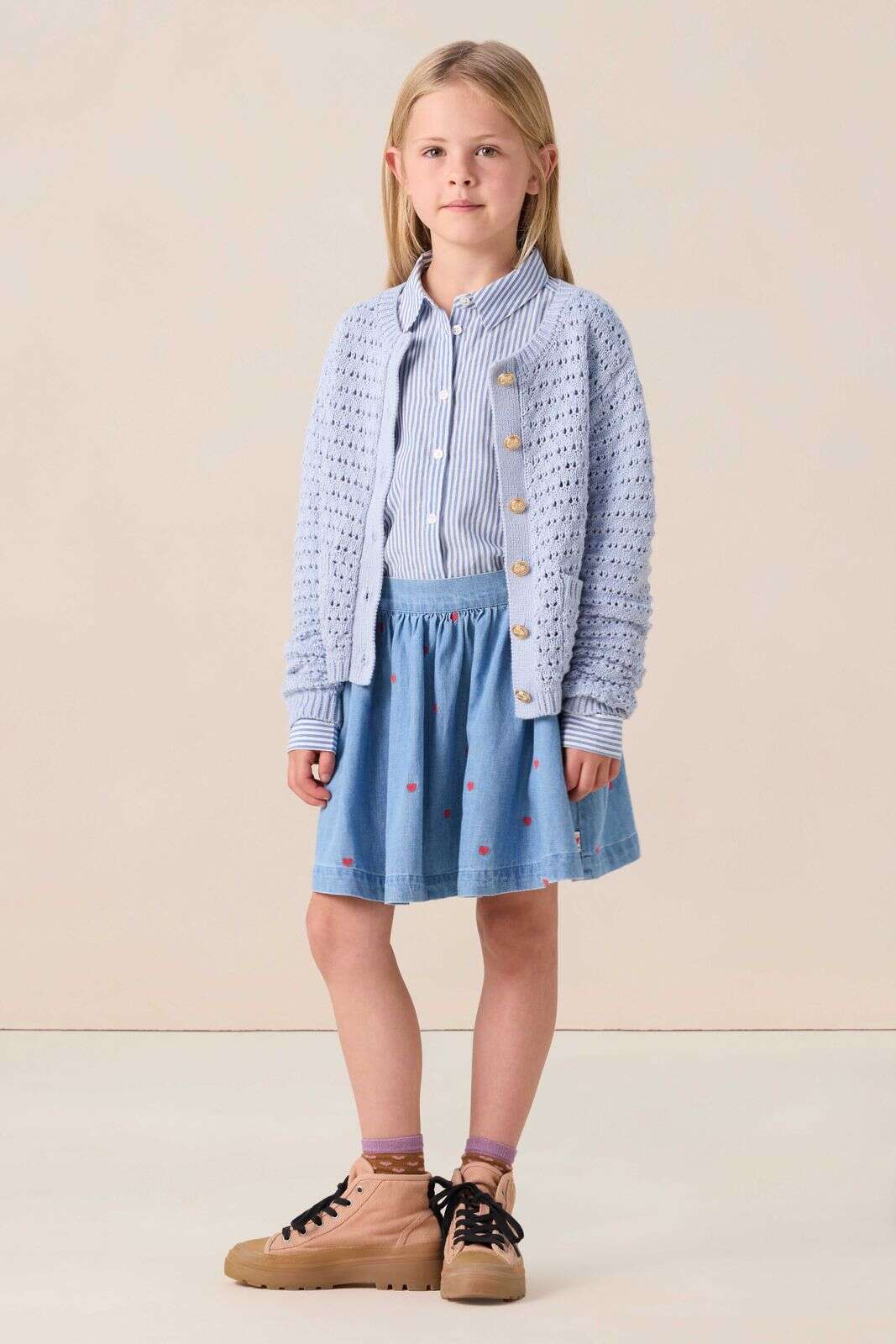 Lichtblauw gebreid vest