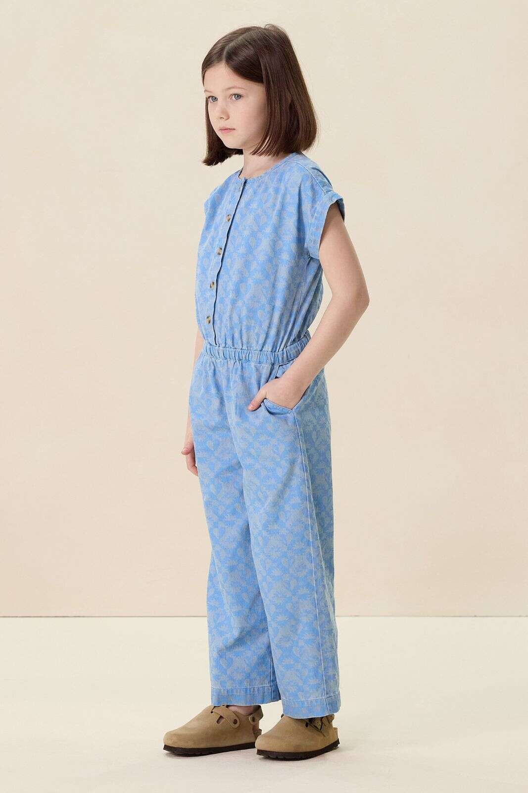 Blauwe denim jumpsuit met print
